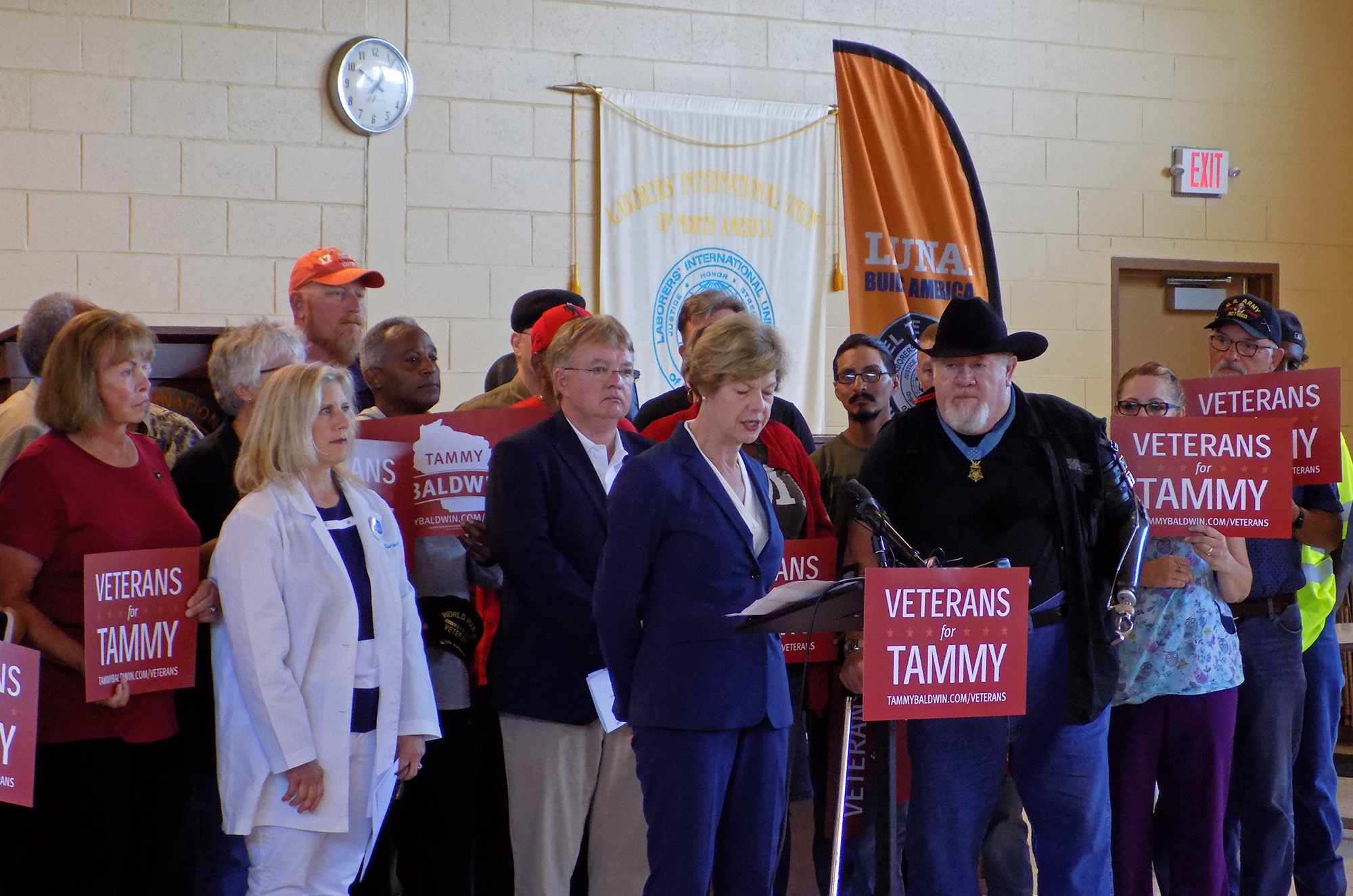 U.S. Sen. Tammy Baldwin surrounded by veterans
