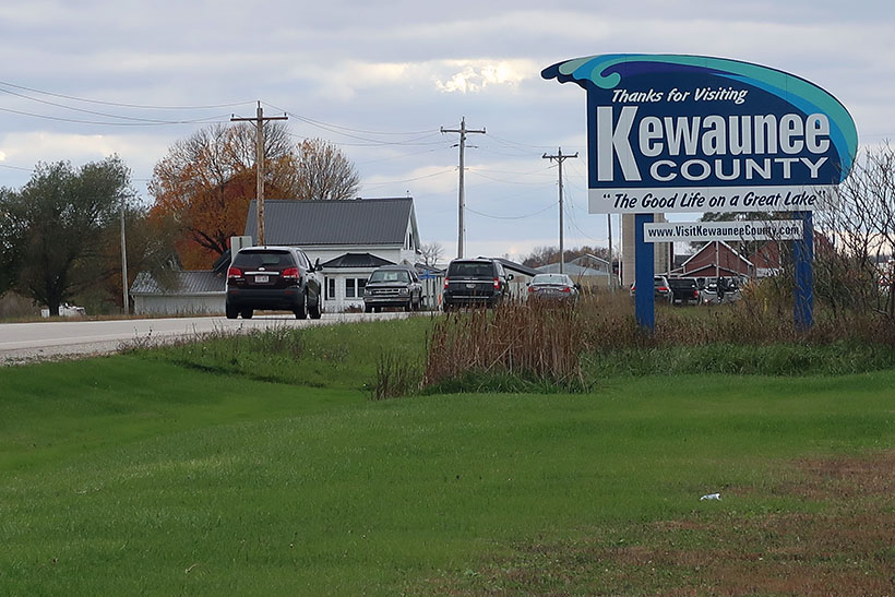 A sign reads "Thanks for visiting Kewaunee County."