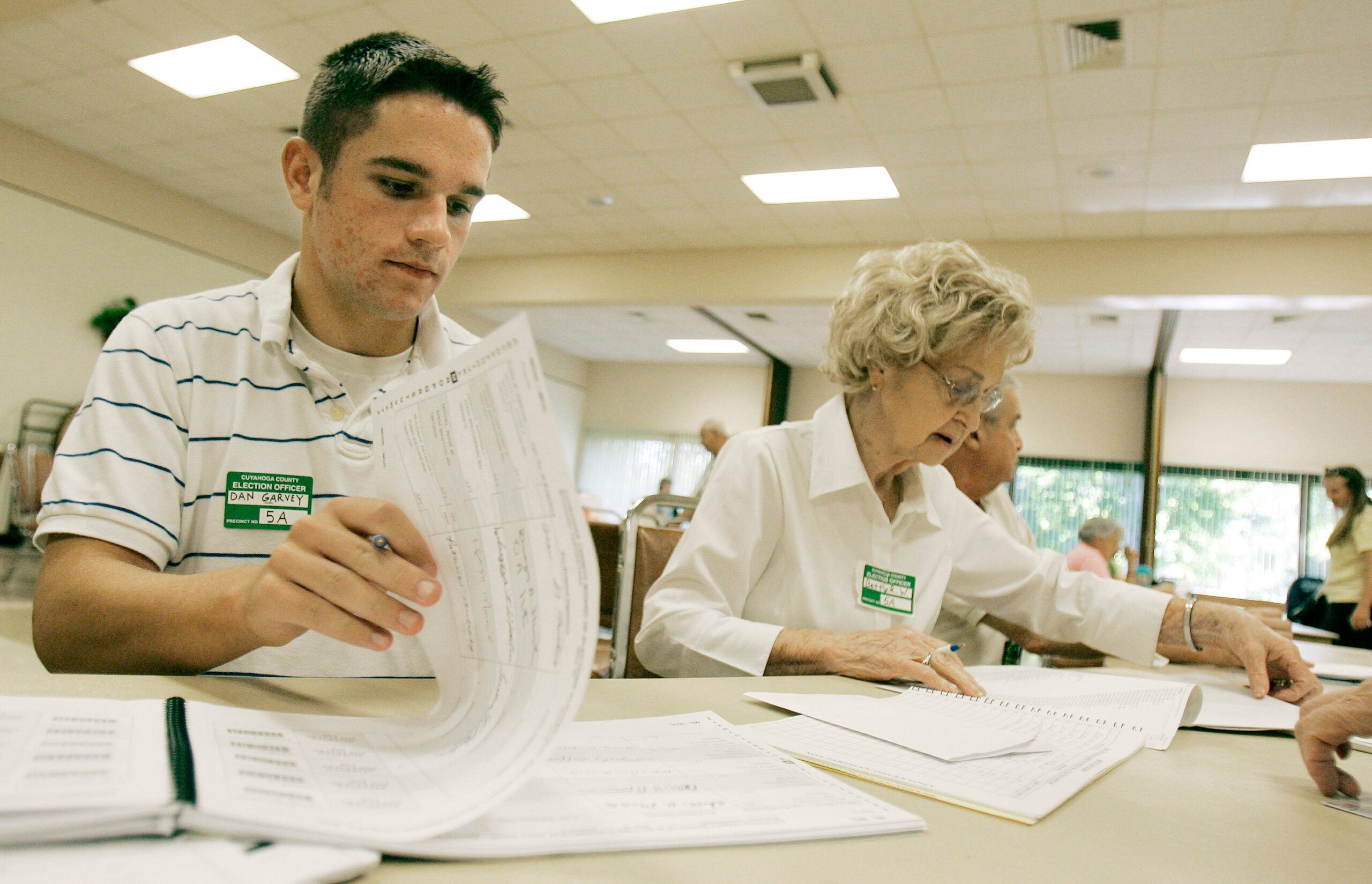 High School student Dan Garvey works at a polling station