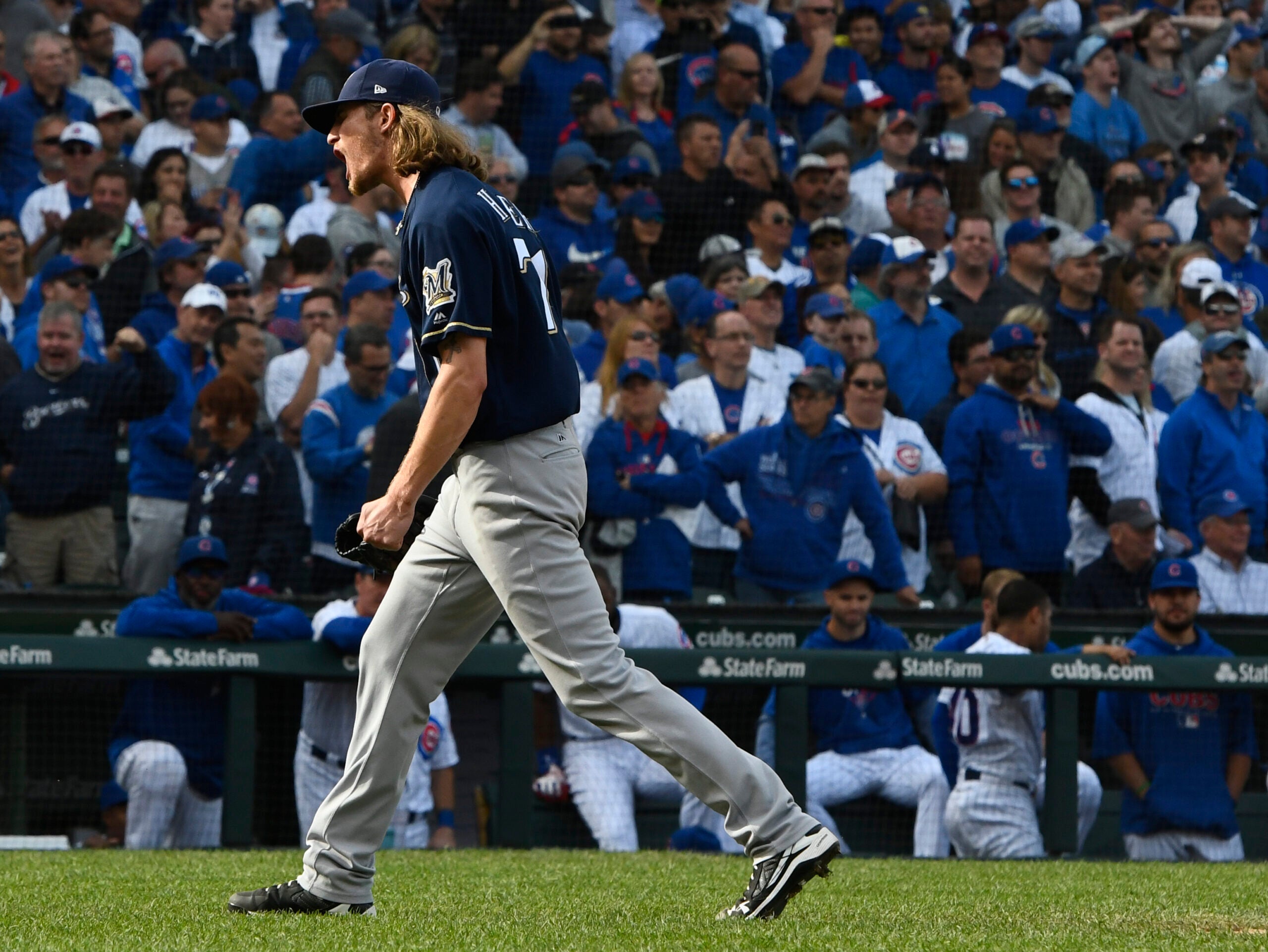 Milwaukee Brewers relief pitcher Josh Hader reacts after defeating the Chicago Cubs