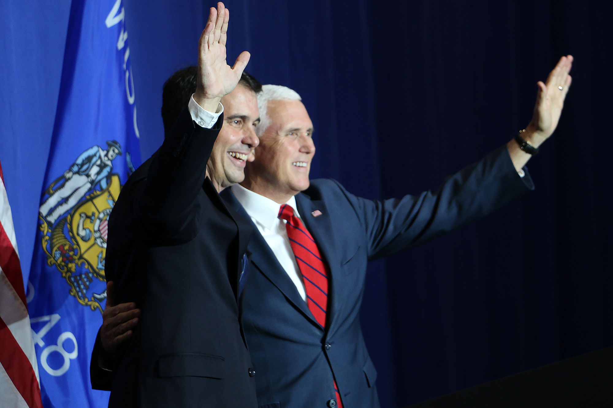 Vice President Mike Pence meets Gov. Scott Walker during a campaign fundraiser