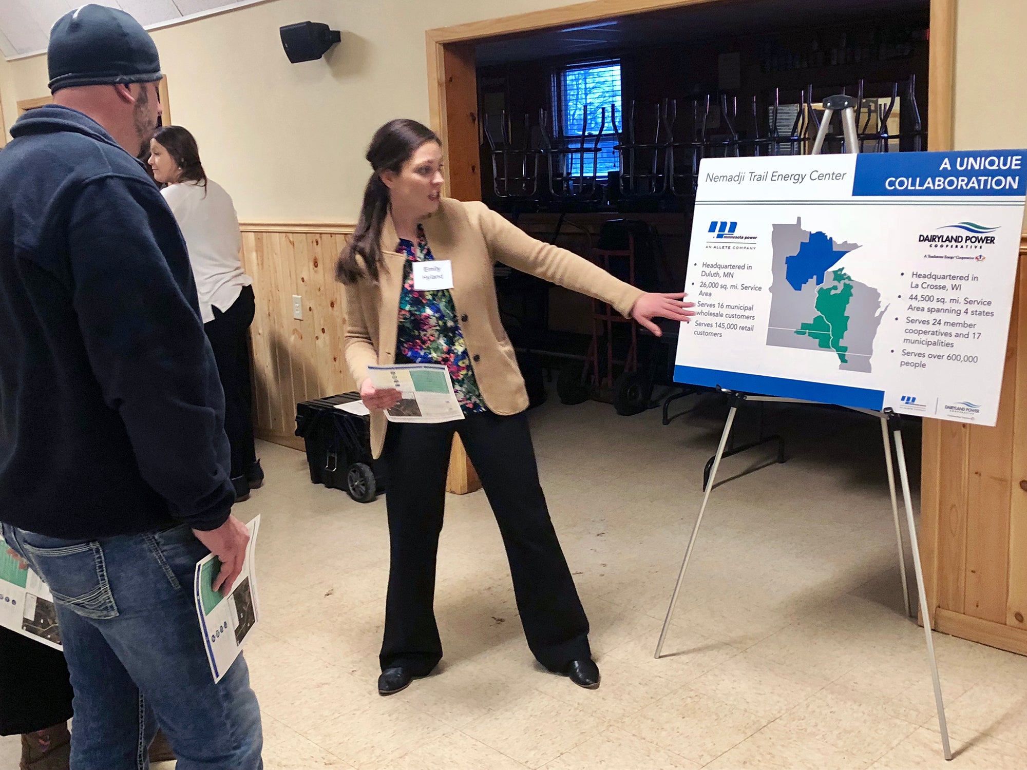 Emily Hyland talks with people about the proposed natural gas plant