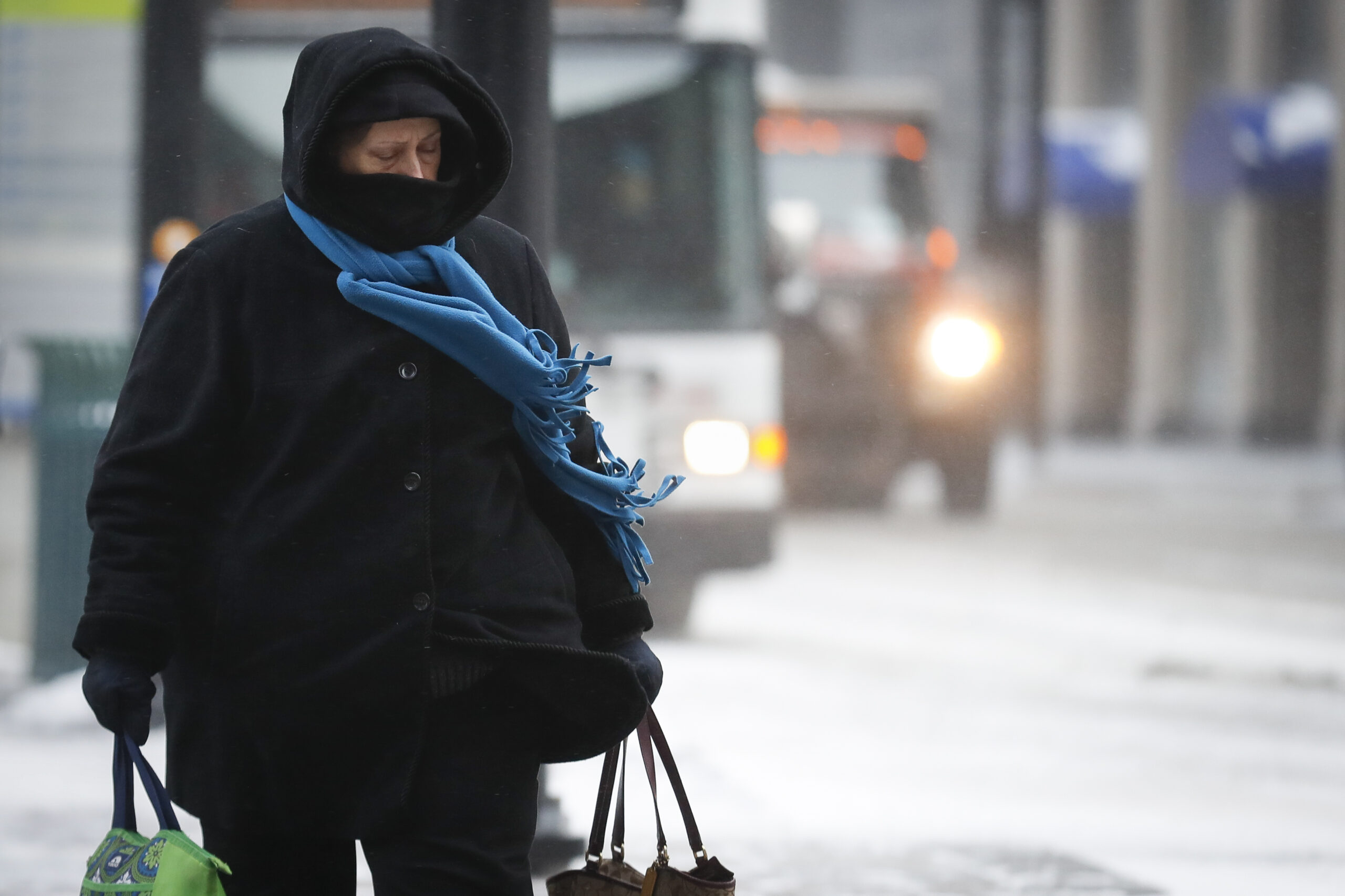 person walking during snowstorm