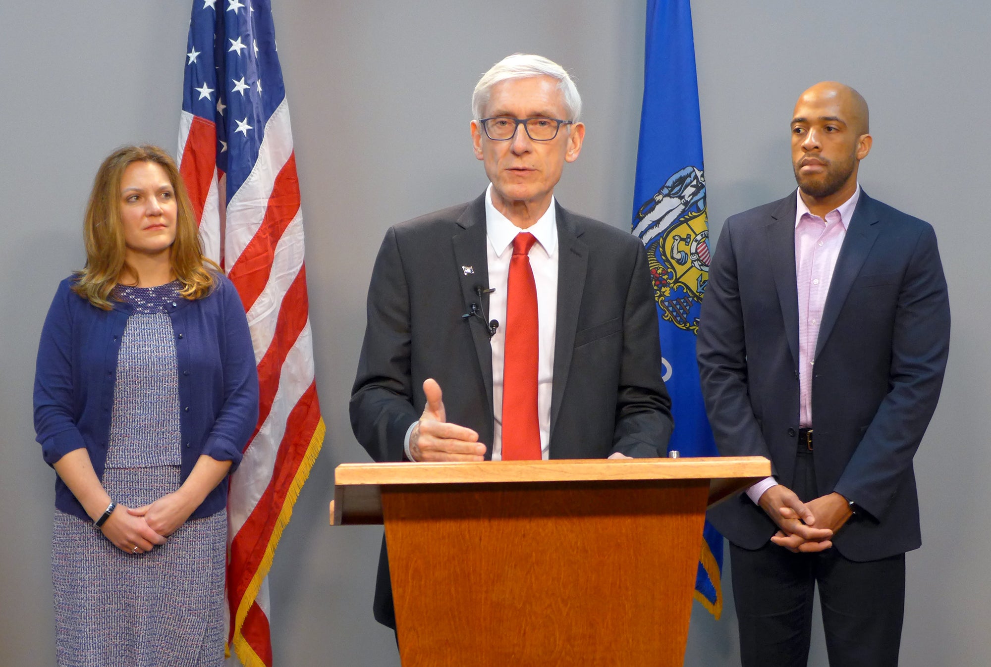 Gov. Tony Evers, joined by DHS Secretary Andrea Palm, left, and Lt. Gov. Mandela Barnes