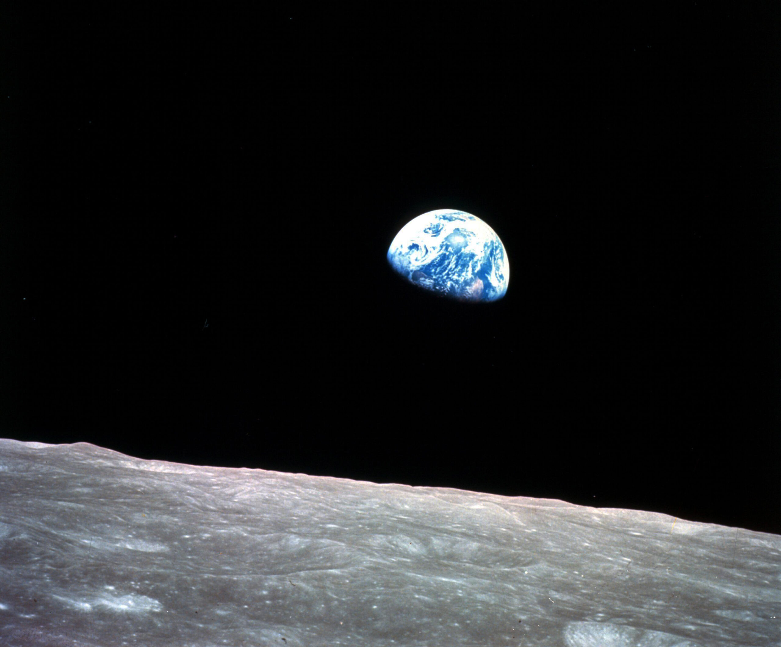 Earth behind the surface of the moon