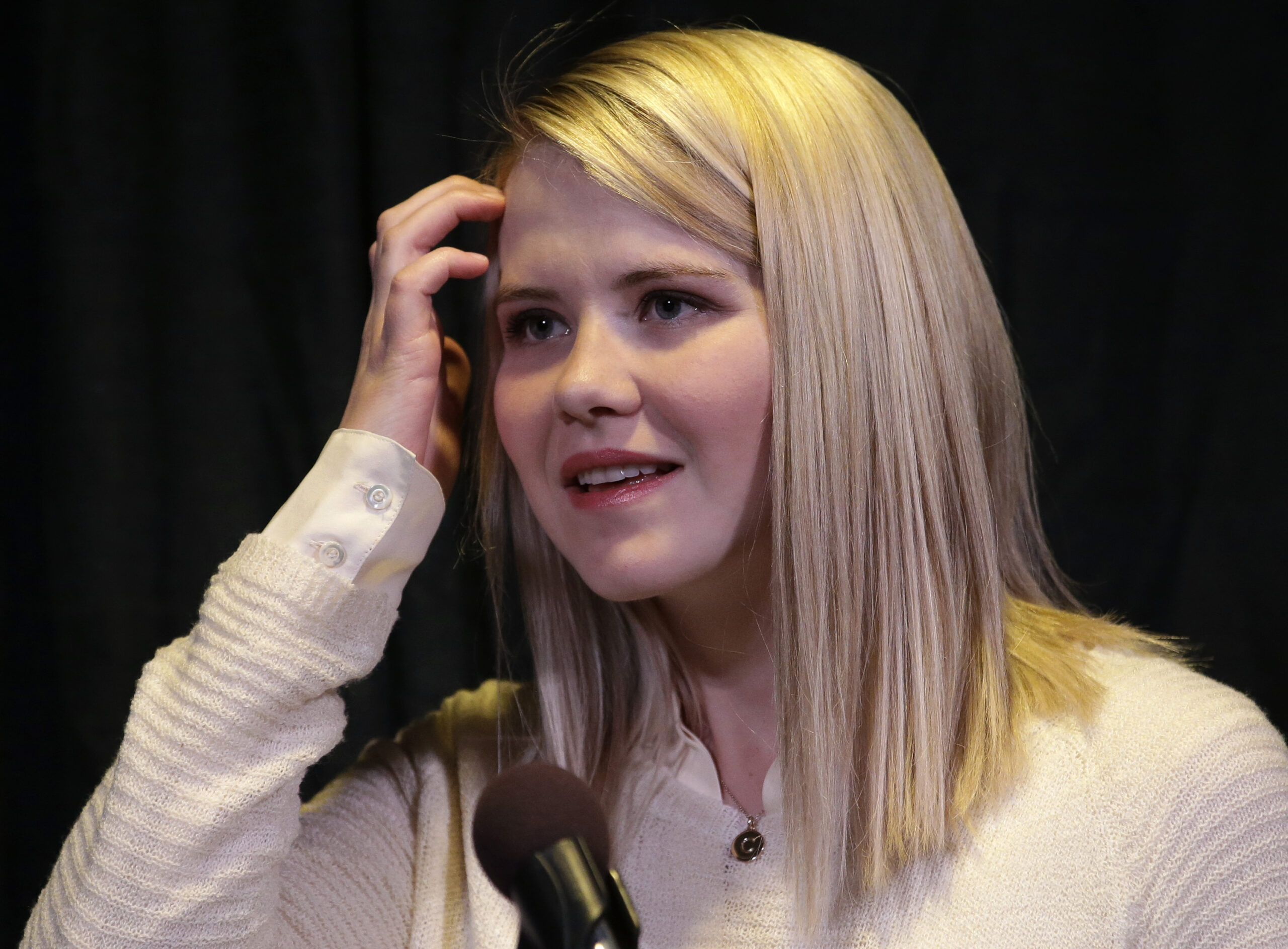 Elizabeth Smart looks on during a news conference