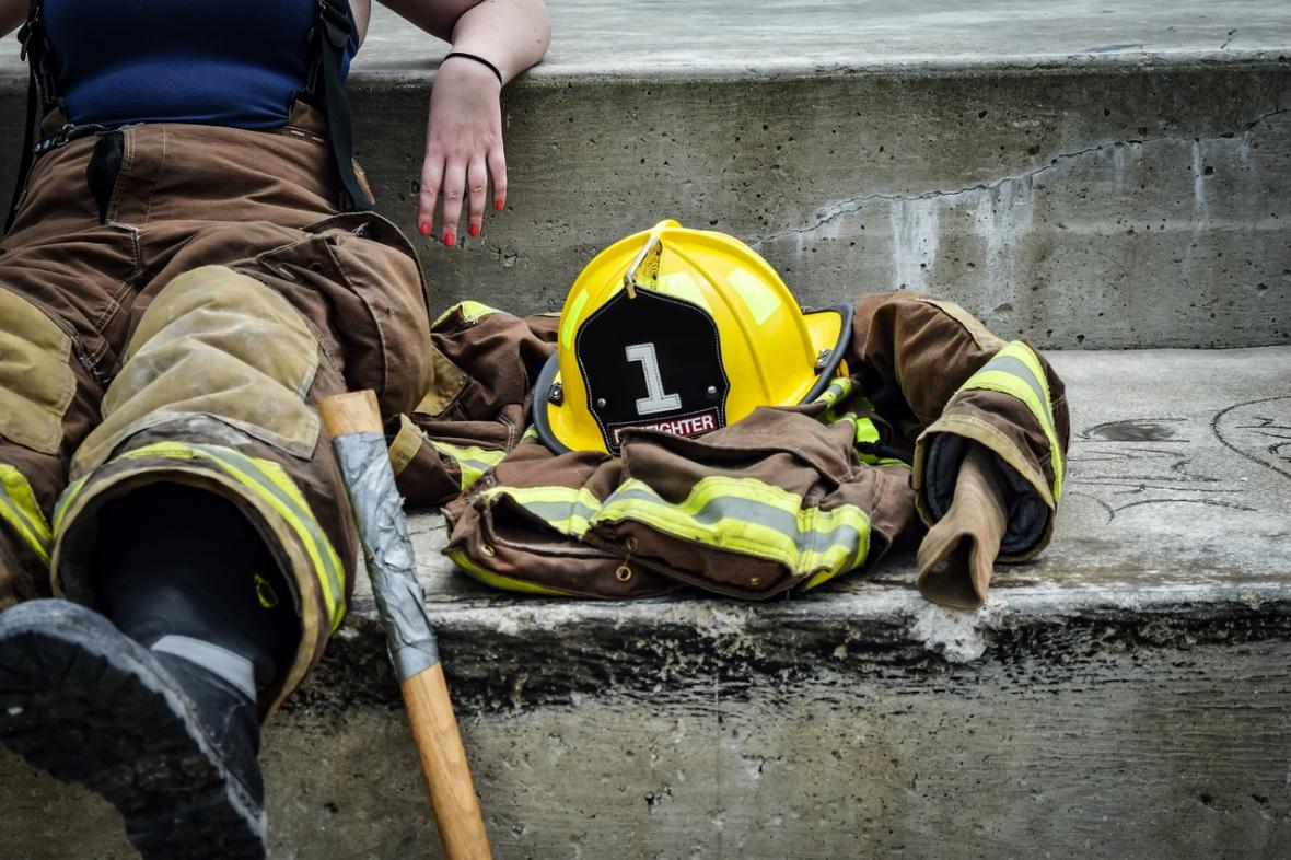 Firefighter sitting next to gear