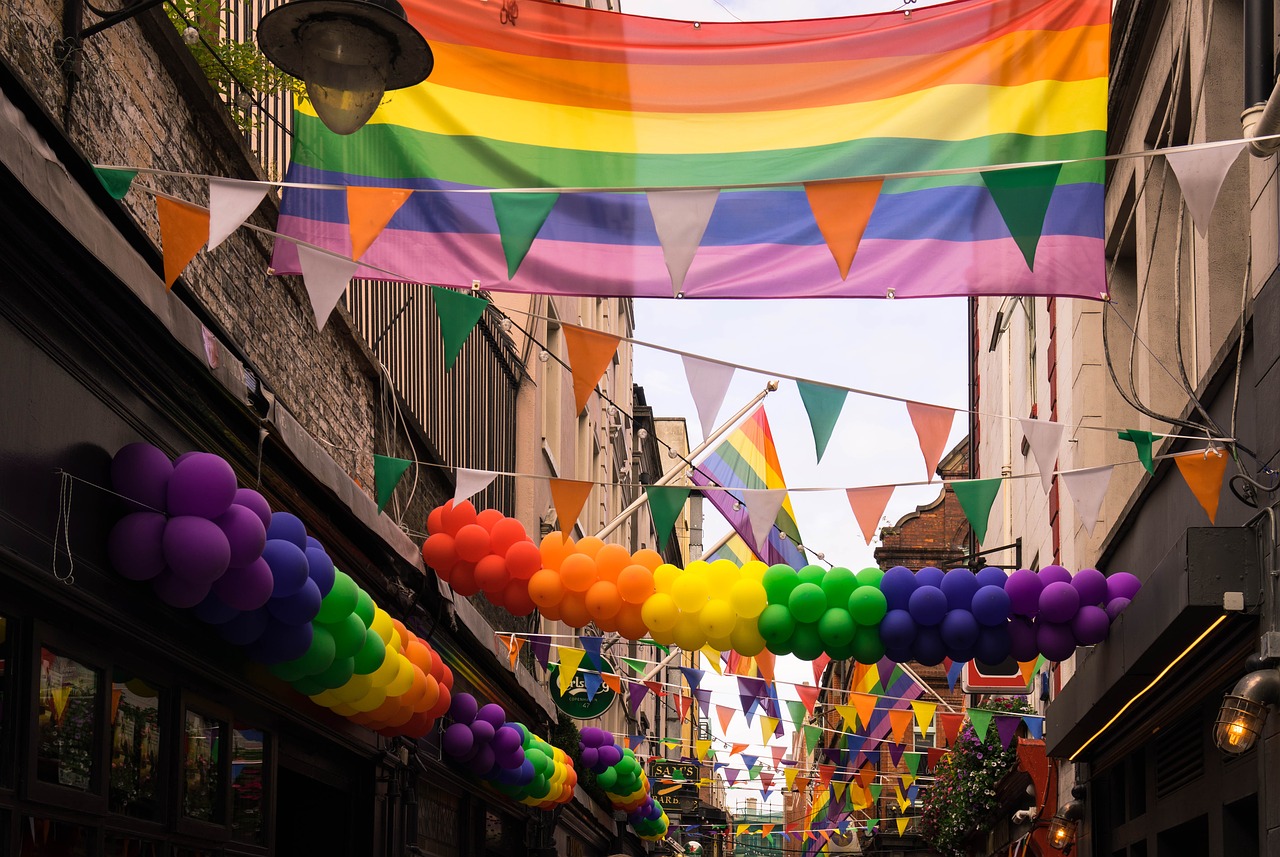 gay flag hanging above festivities