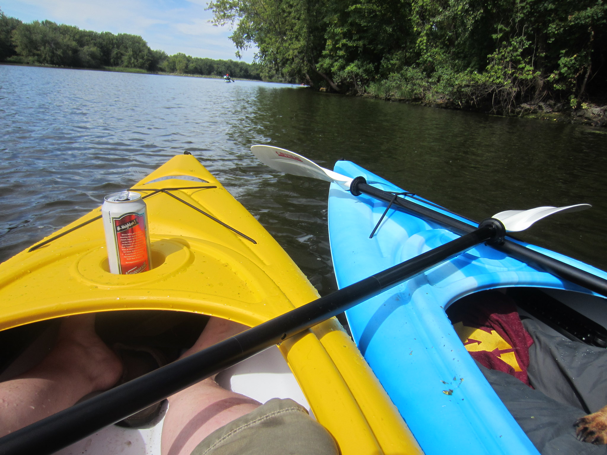 front of two kayaks in water