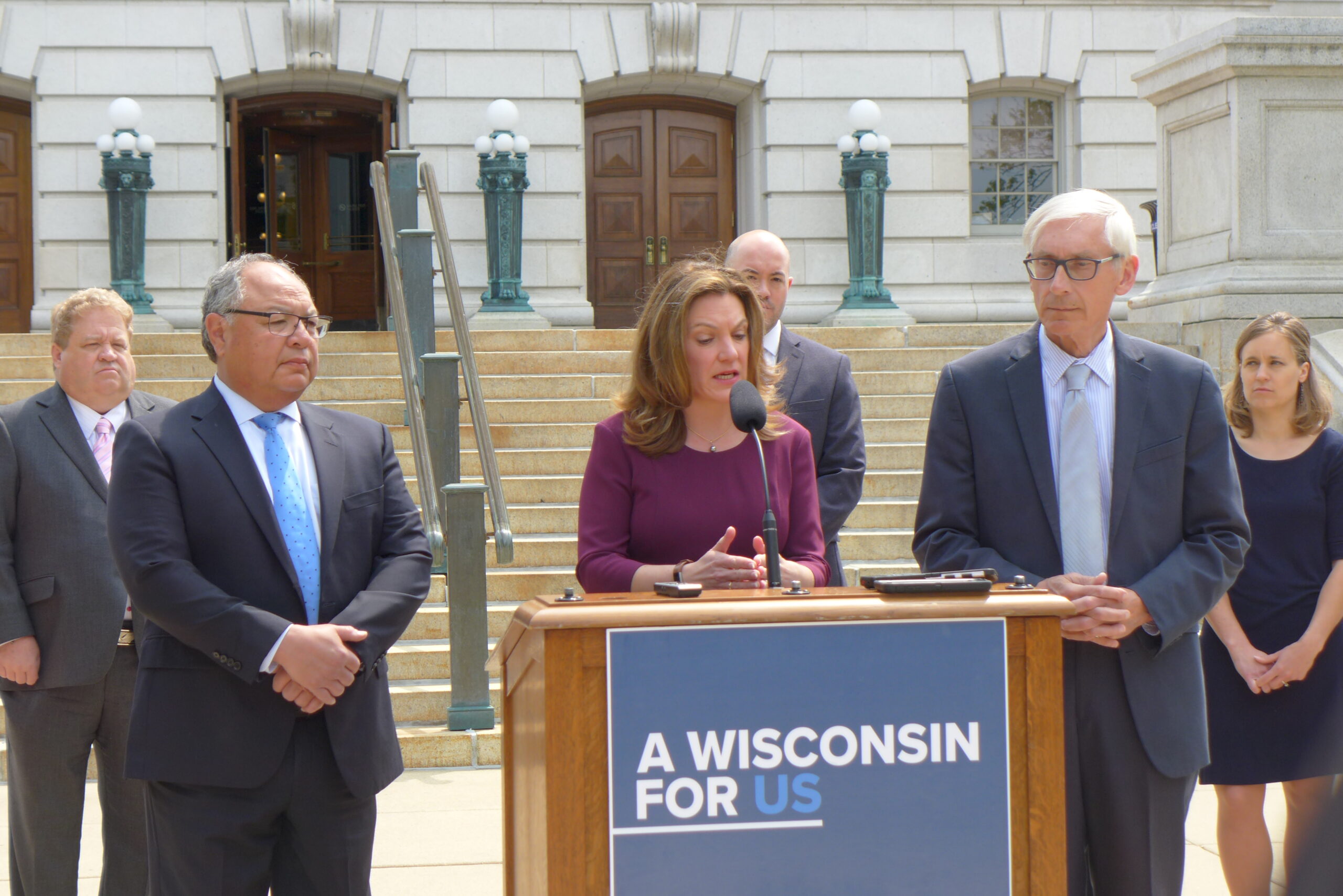 DHS Secretary Andrea Palm speaks at the state Capitol