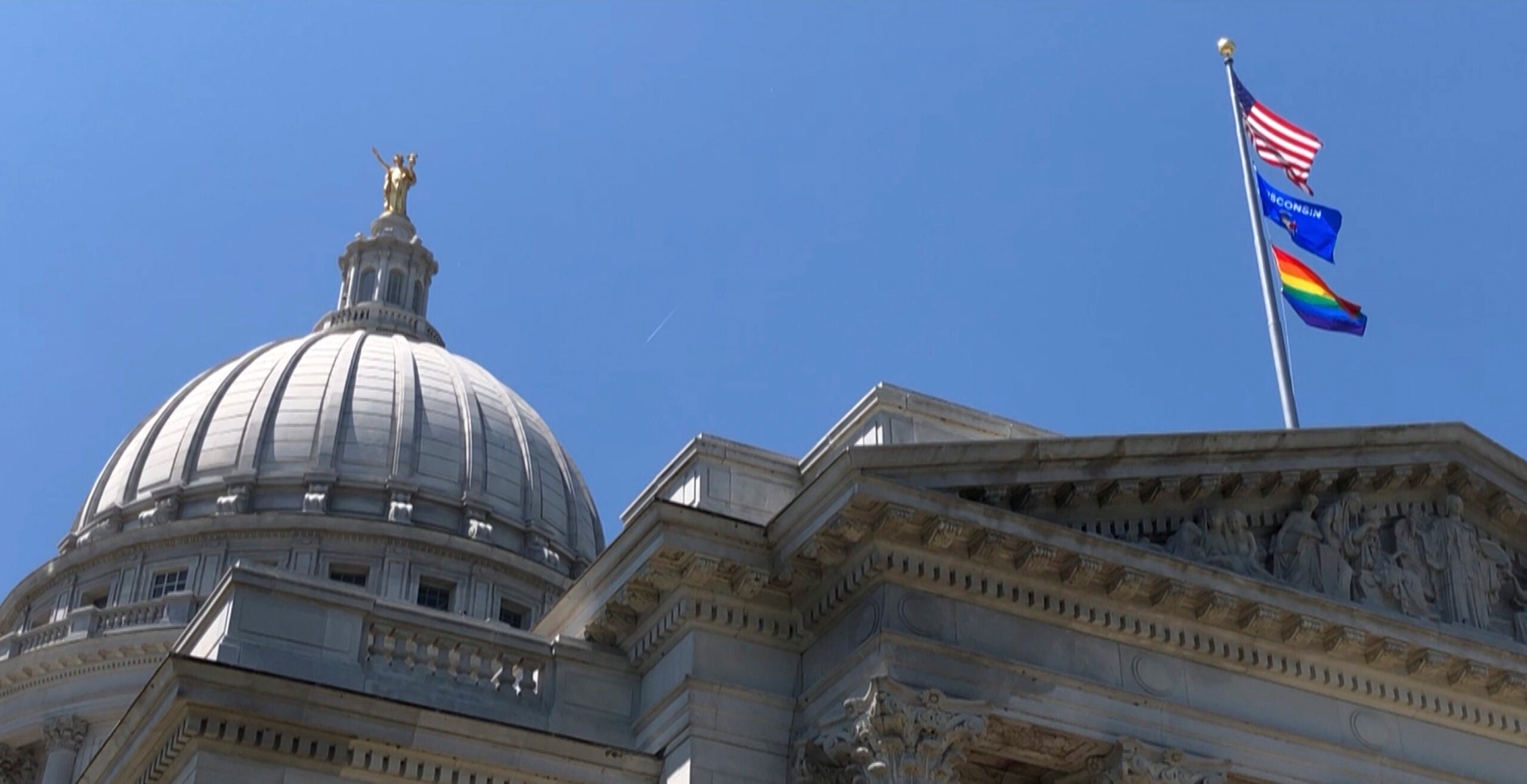 Gay pride flag over Wisconsin capitol building