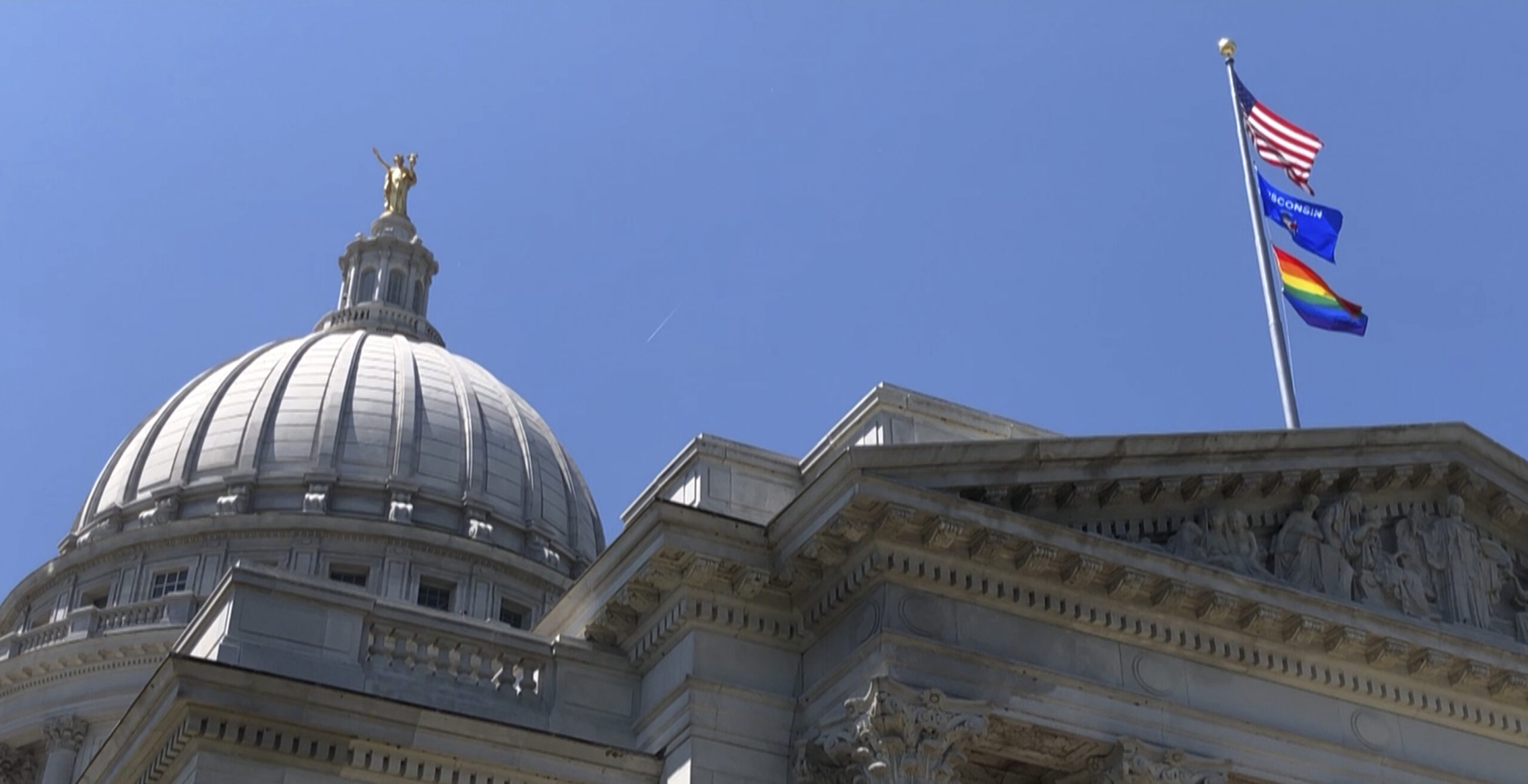 Gay pride flag over Wisconsin capitol building