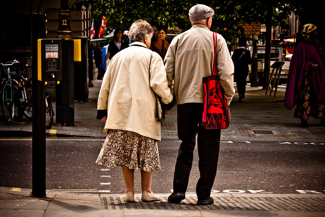 Aging Couple Crossing The Street