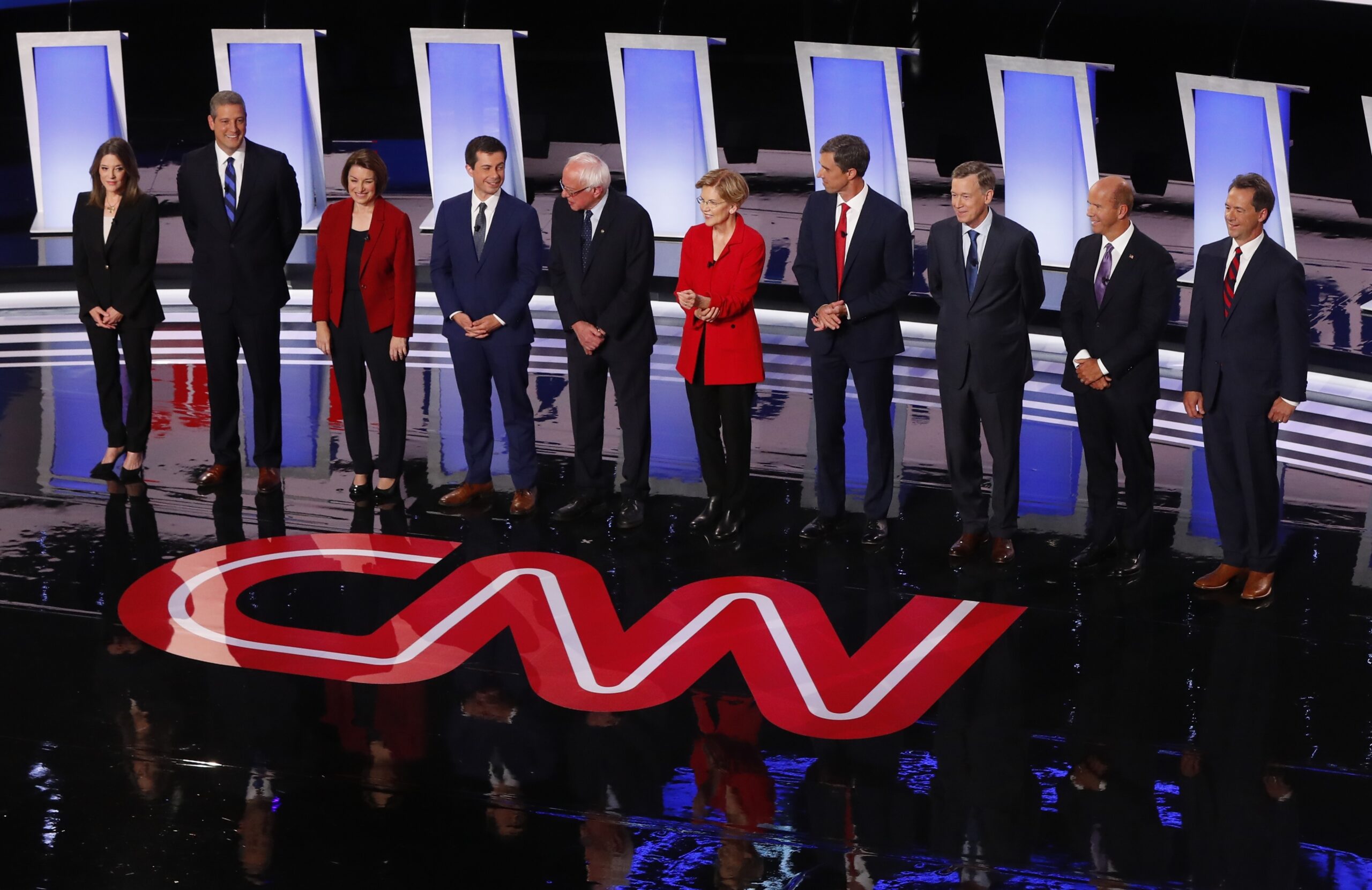 Ten candidates stand on a stage for the first of two Democratic presidential primary debates