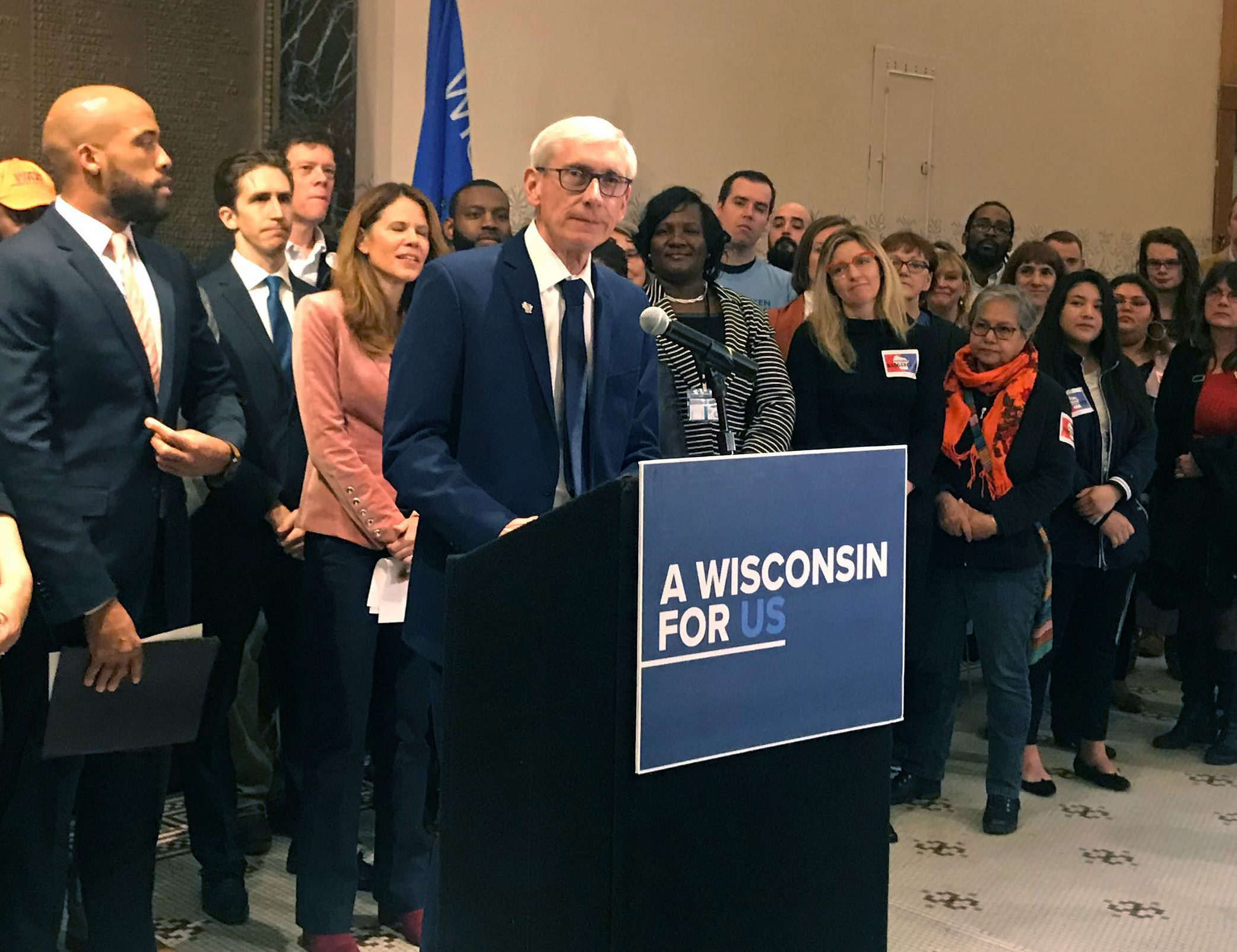 Evers speaking at press conference