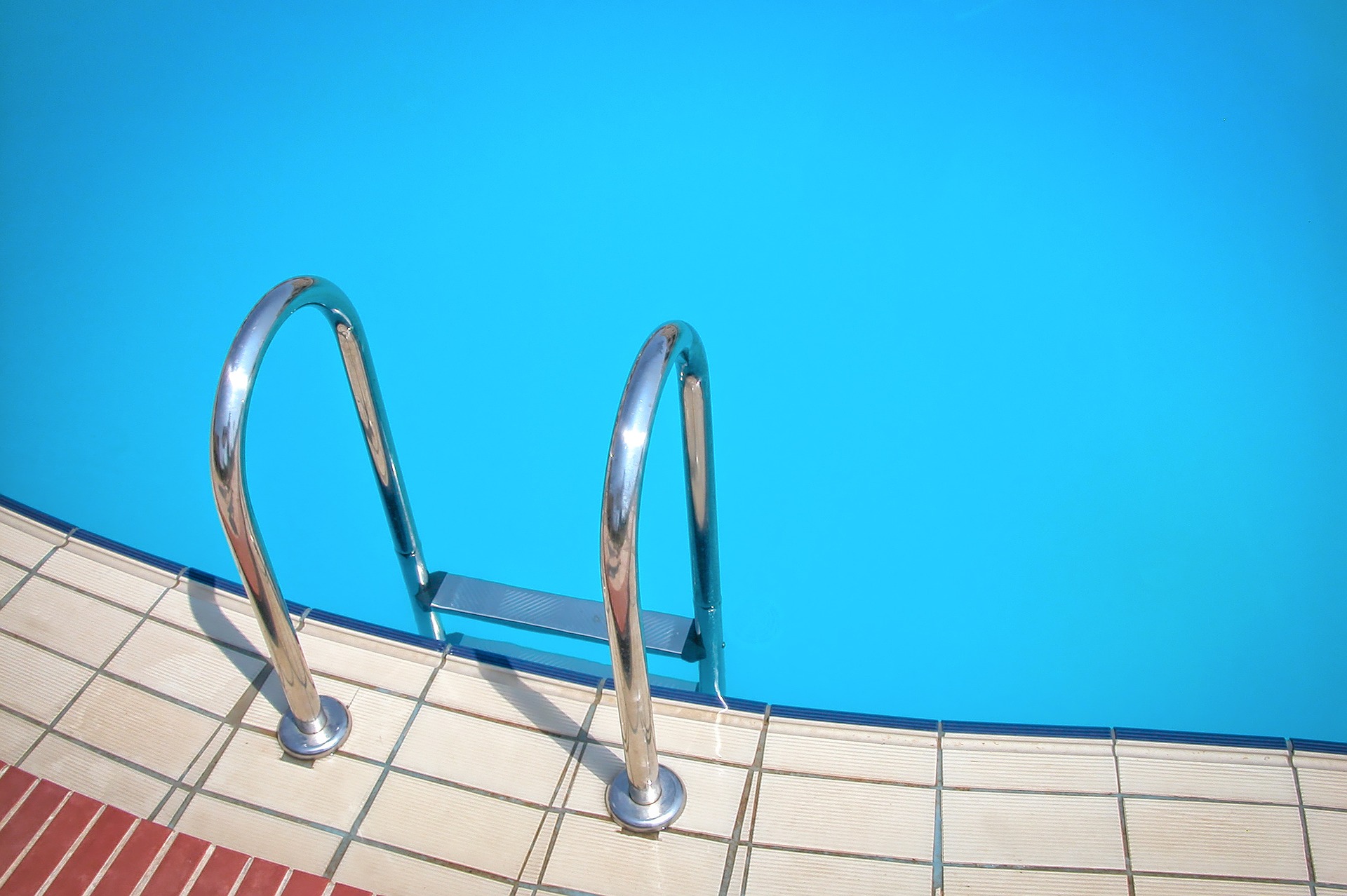 Pool ladder on the side of a pool
