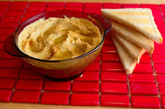 Bowl of hummus with pita bread