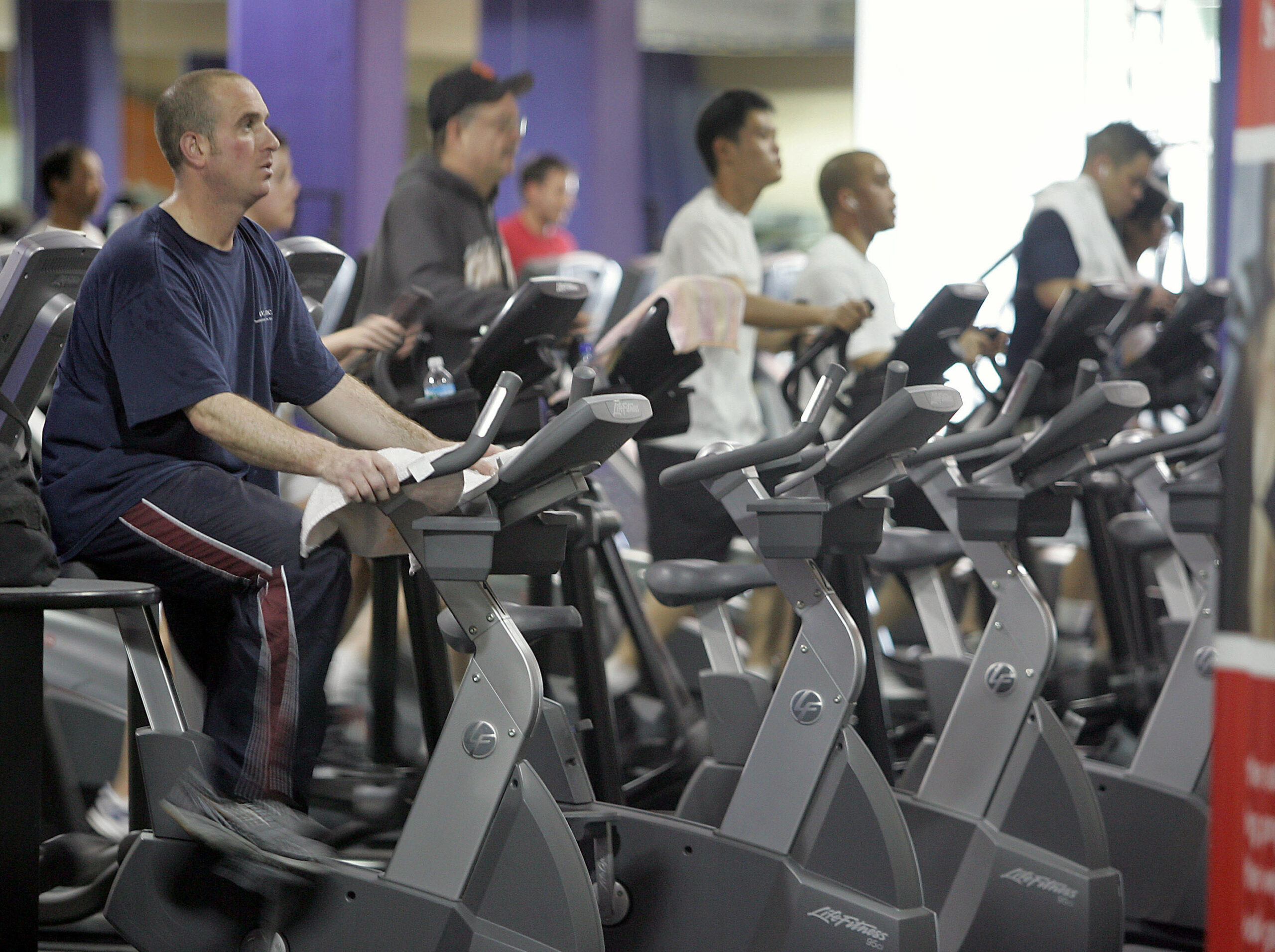 People on exercise bikes and treadmills