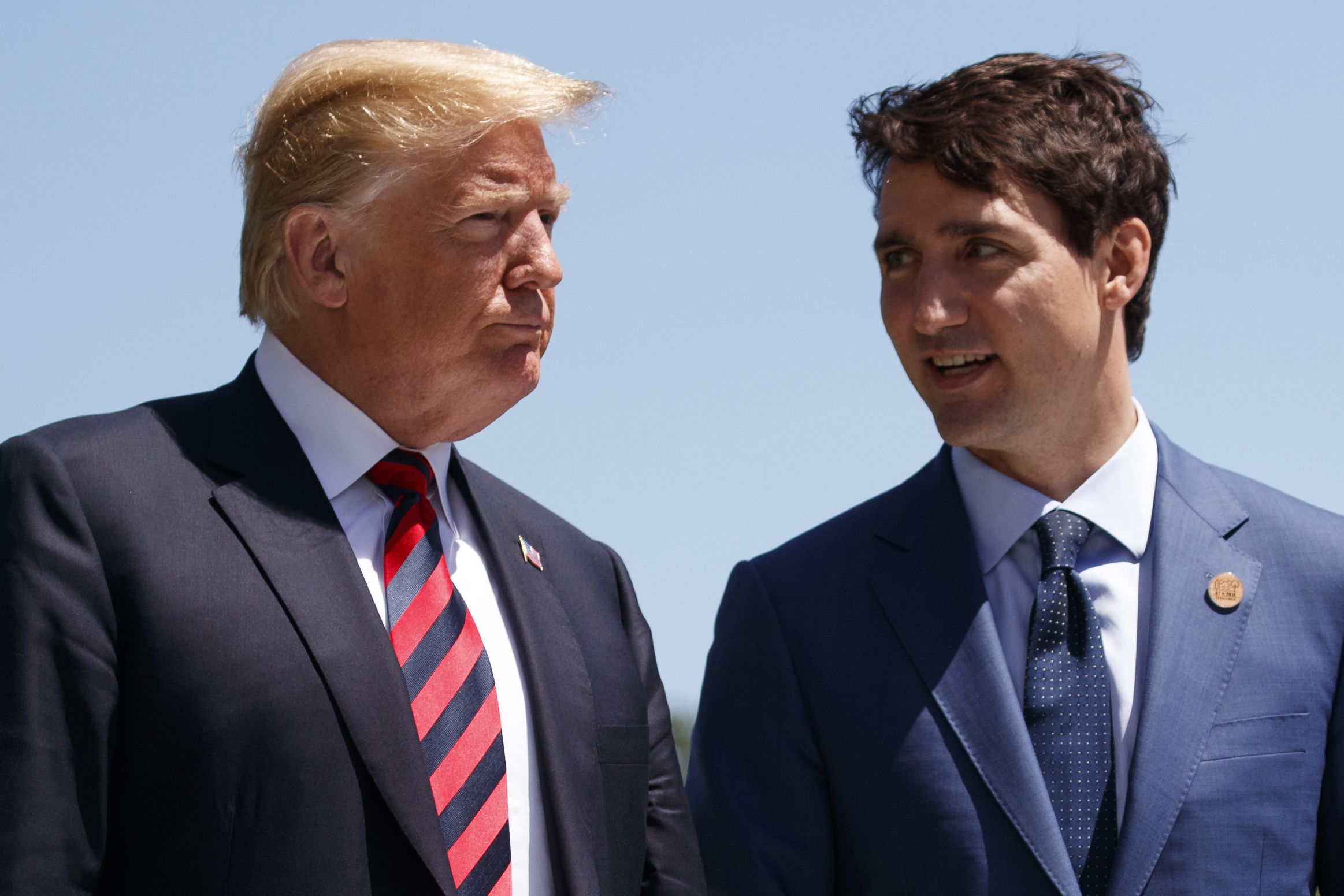 President Donald Trump talks with Canadian Prime Minister Justin Trudeau at the G7 Summit