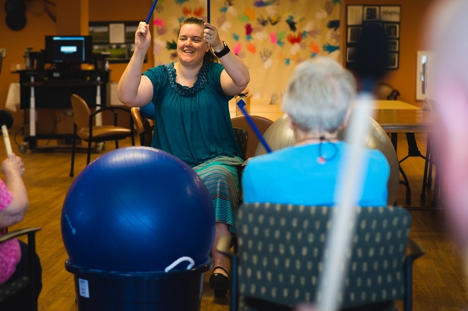 Melissa Cole sings with Oakwood Village Prairie Ridge residents
