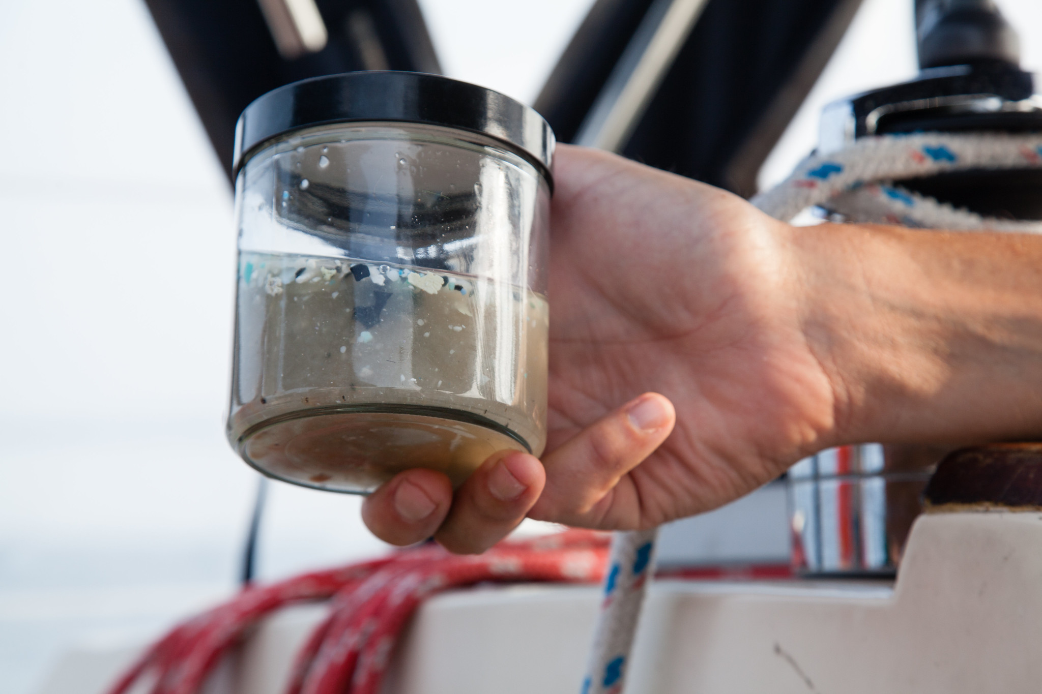 scientist holds a microplastics sample collected