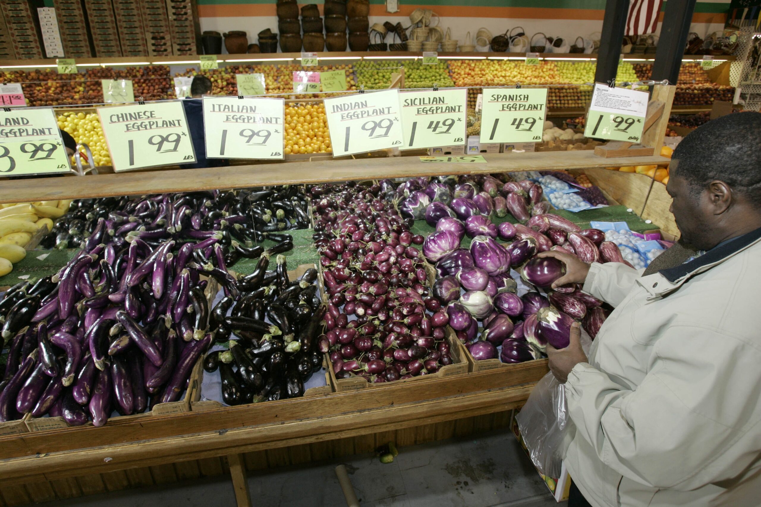 Variety of eggplants at a market
