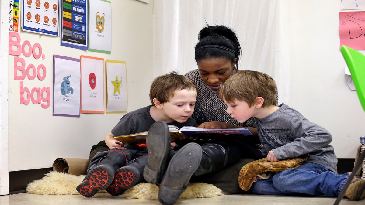 teacher reads to children