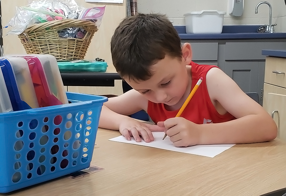 Declan Brommerich, 6, draws in his first-grade classroom at Trempealeau Elementary School.