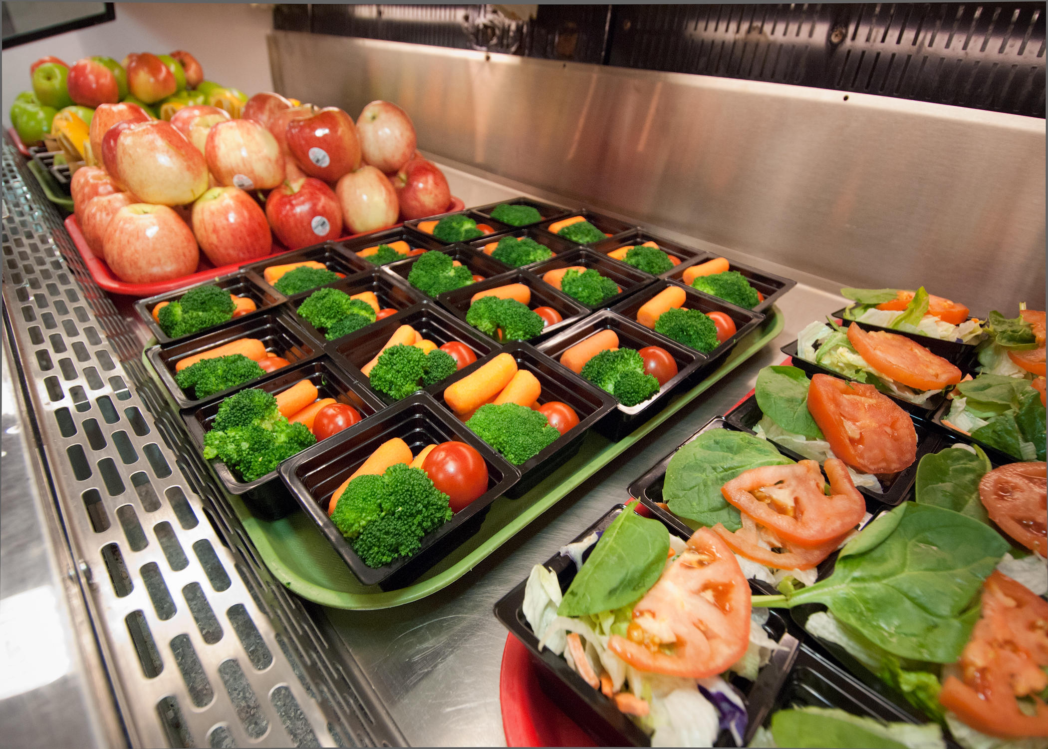 School lunch trays filled with food