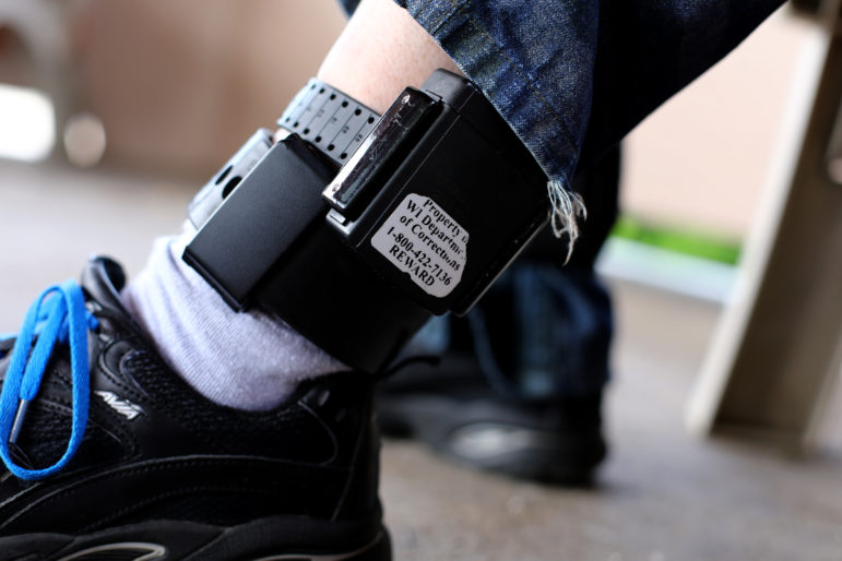 registered sex offender shows his GPS ankle monitoring equipment