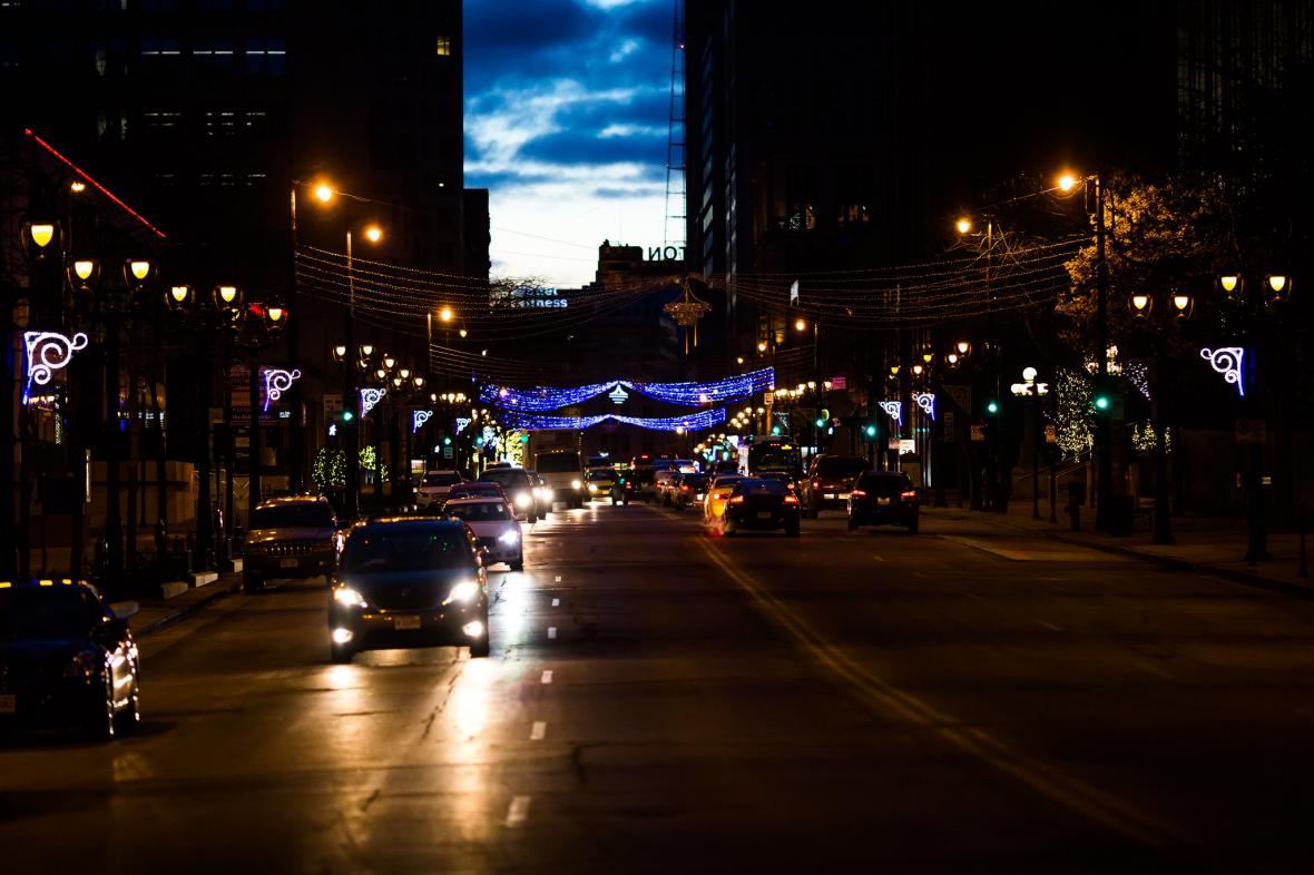 Cars drive at night in downtown Milwaukee
