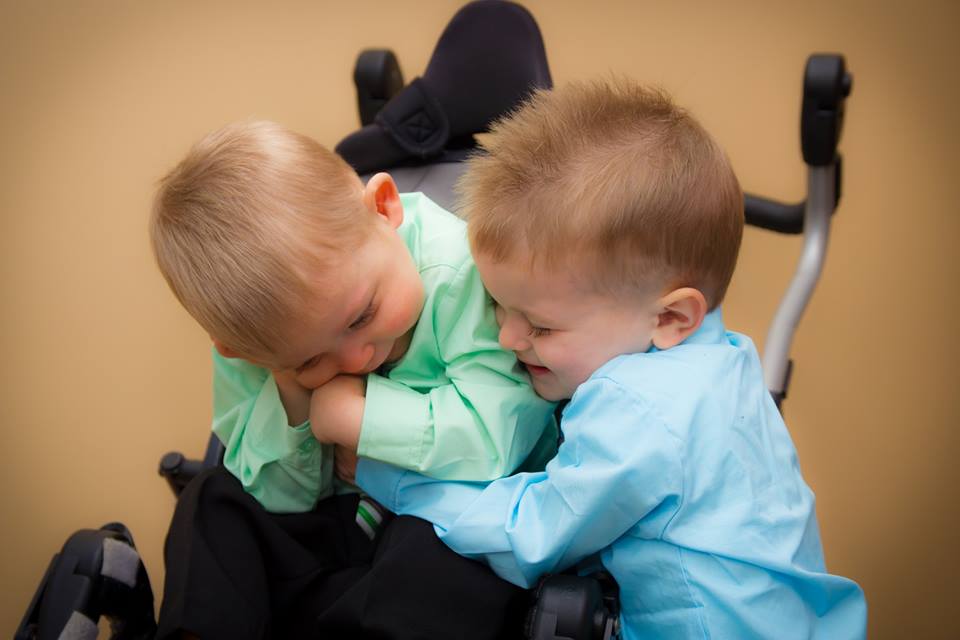 Josiah Hoerter, left, gets a hug from his brother Isaiah