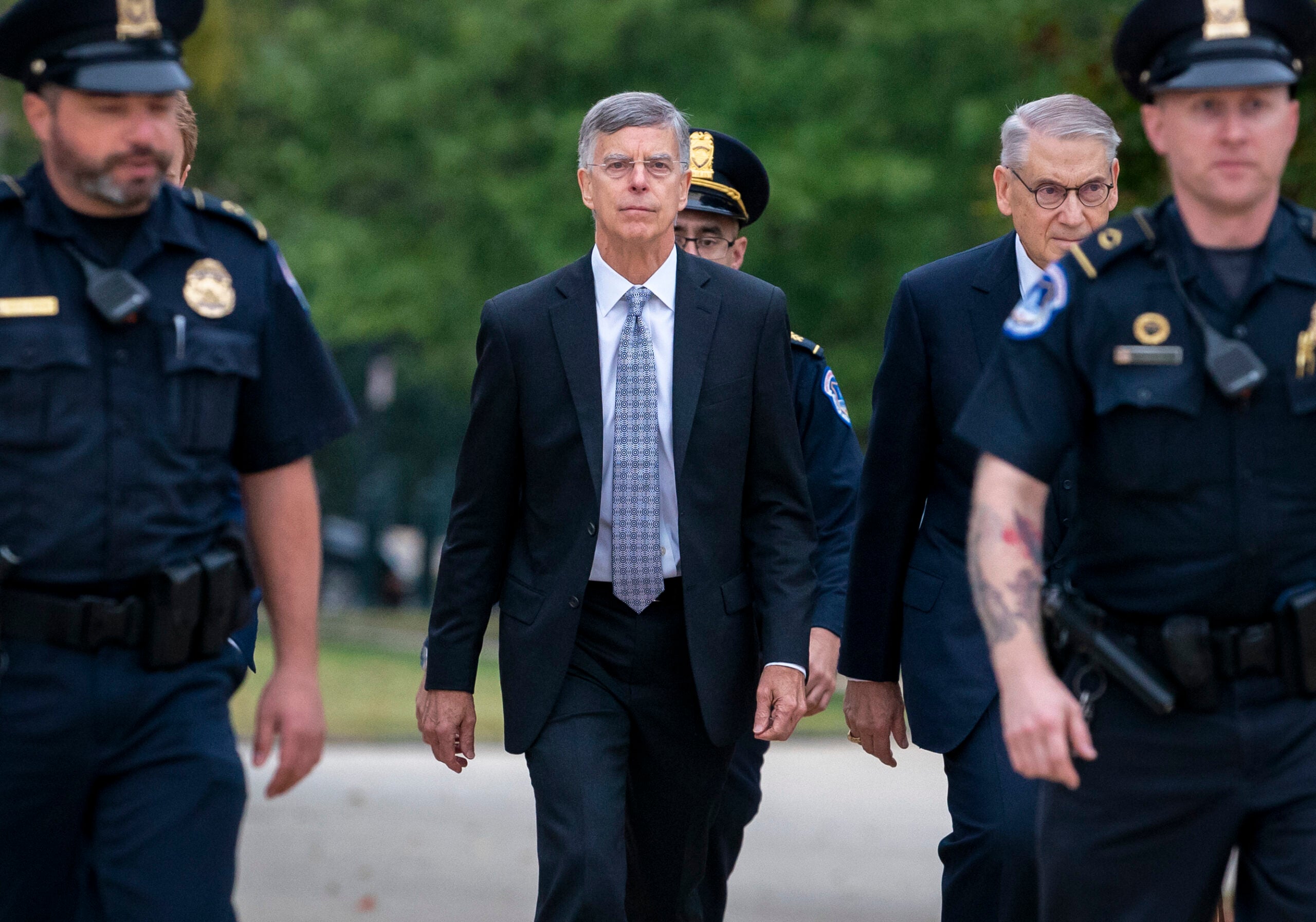 Ambassador William Taylor, is escorted by U.S. Capitol Police