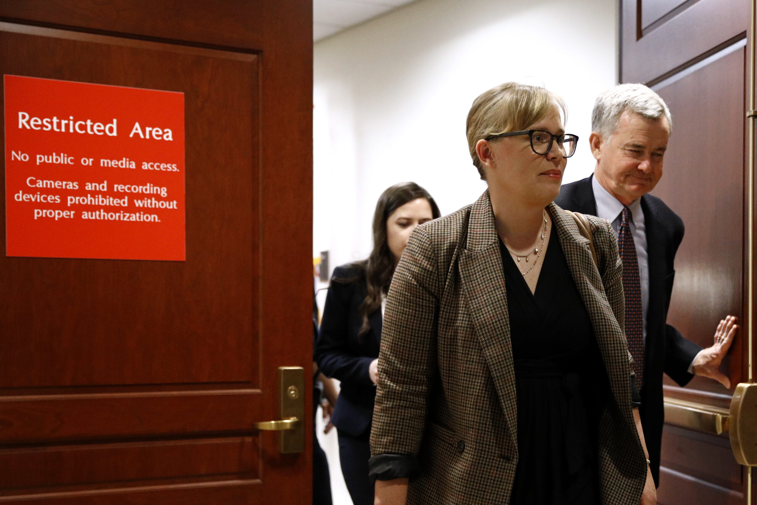 Catherine Croft, a State Department adviser on Ukraine, departs a secure area of the Capitol