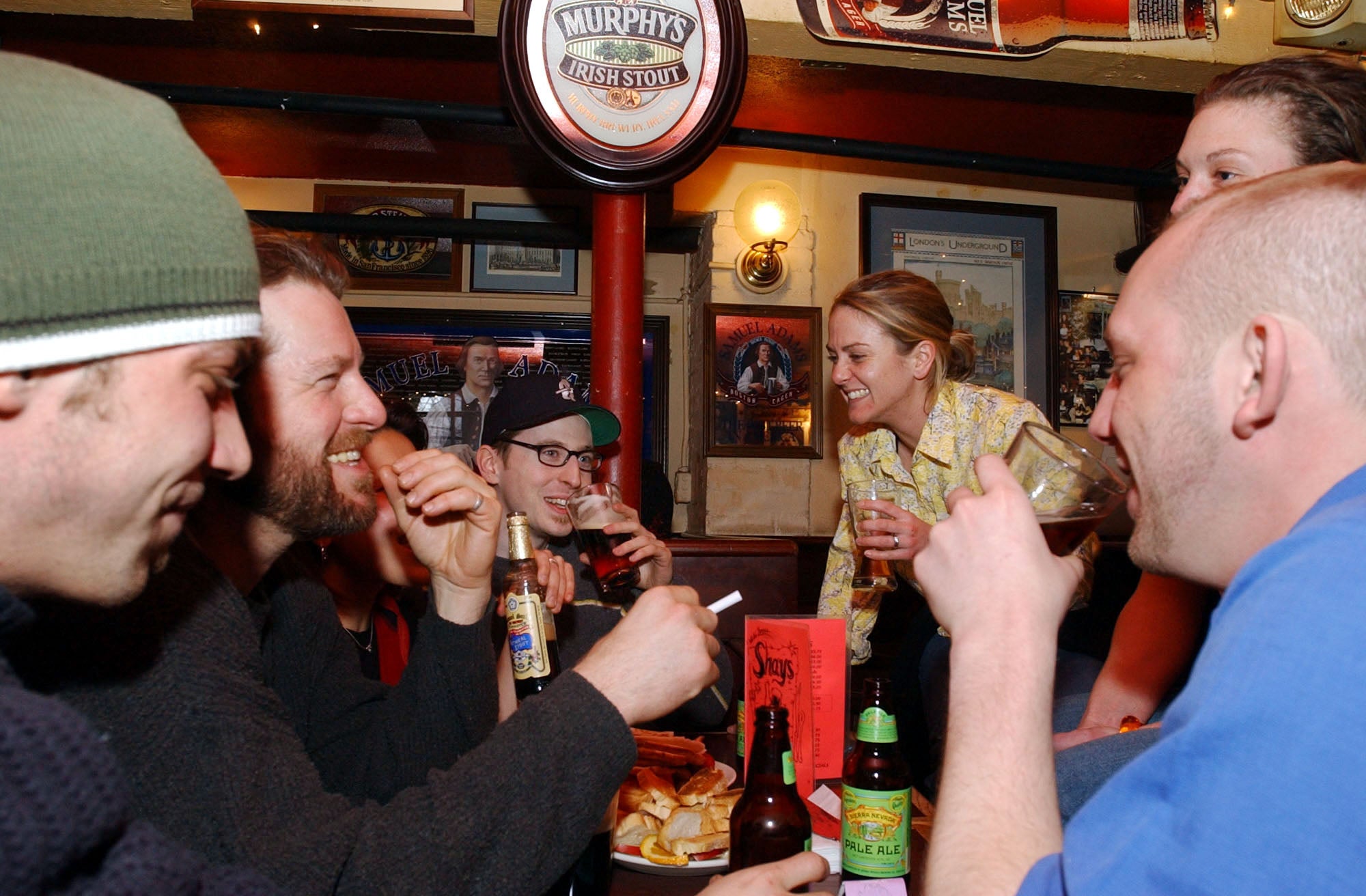 Students enjoy a few beers at a pub.