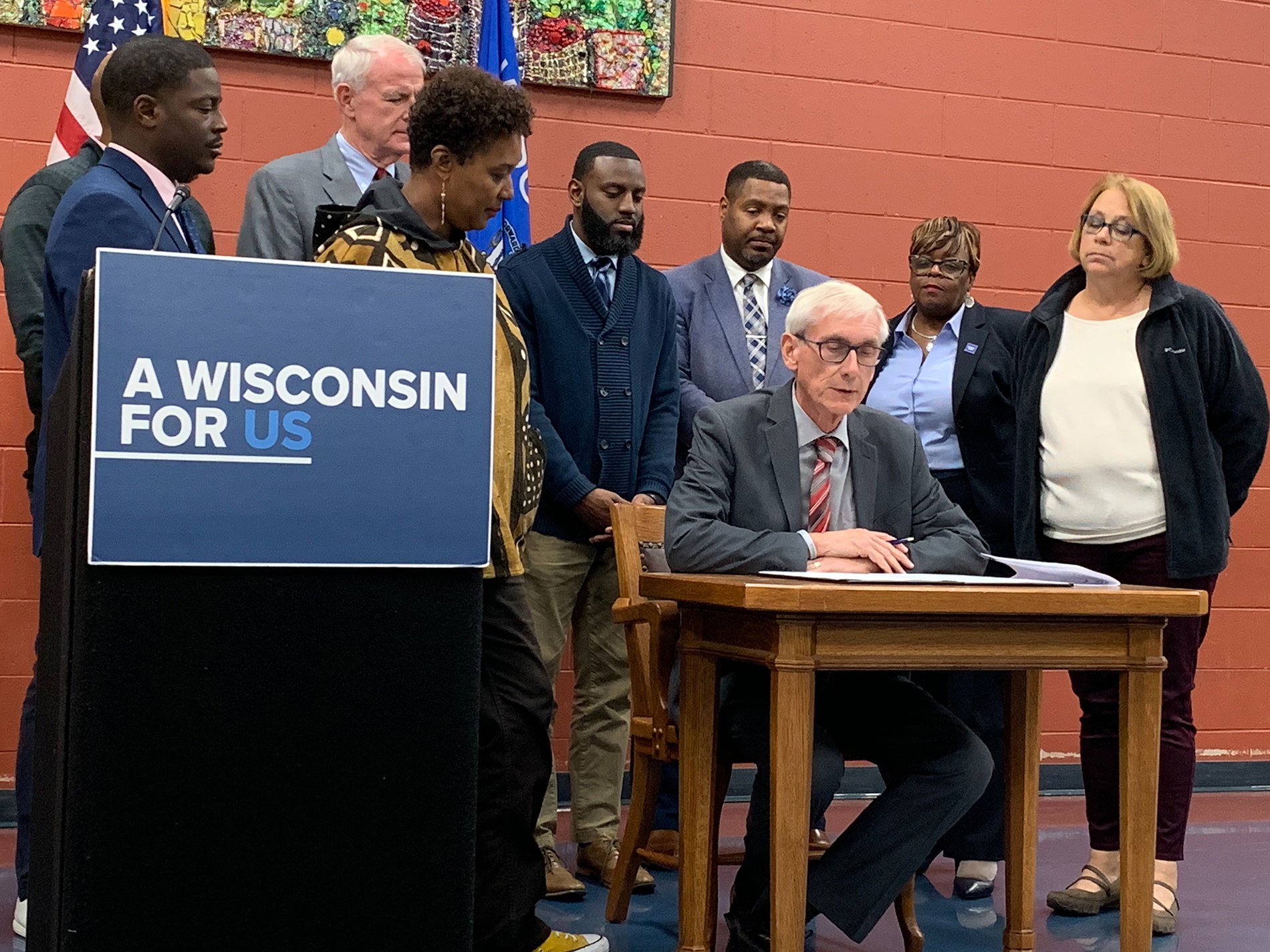 Gov. Tony Evers signs an executive order