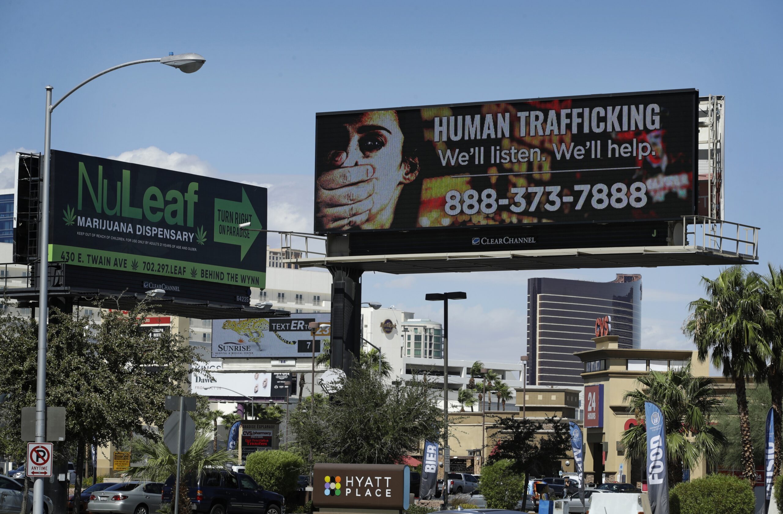 A billboard displays a phone number for the National Human Trafficking Hotline, Thursday, Sept. 21, 2017, in Las Vegas.