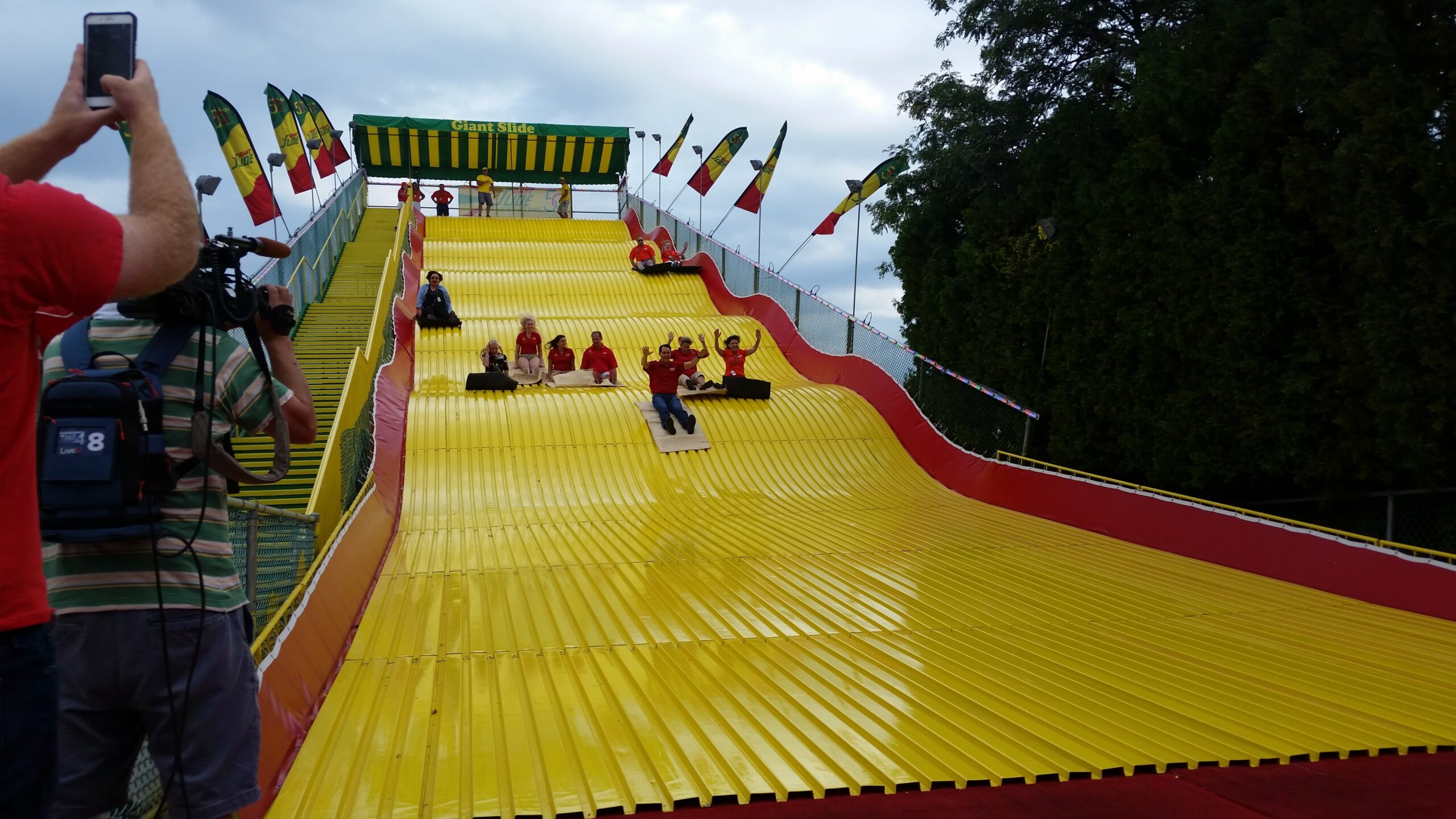 Gov. Scott Walker goes down the Giant Slide at the Wisconsin State Fair