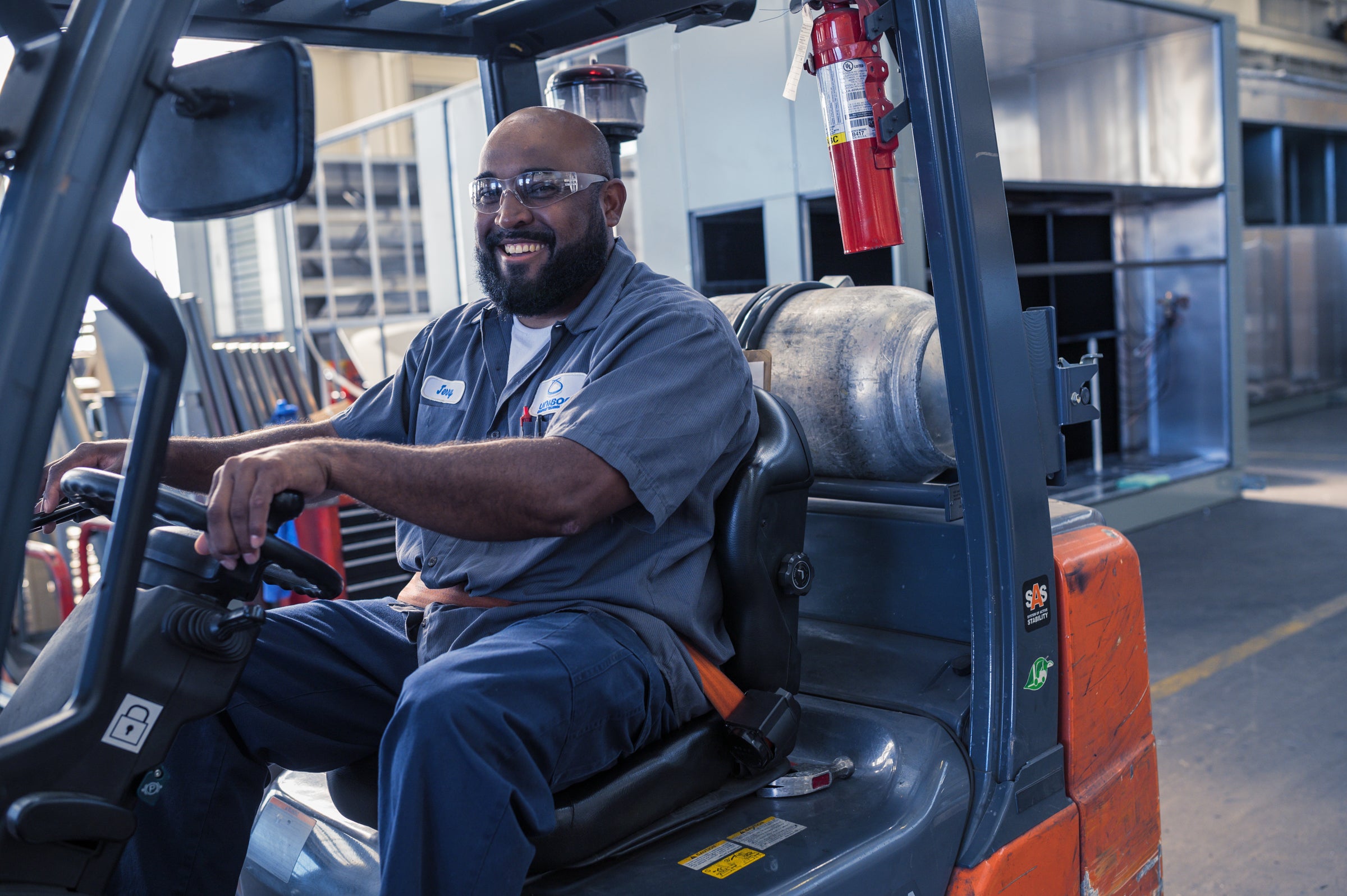 a factory worker operating equipment.