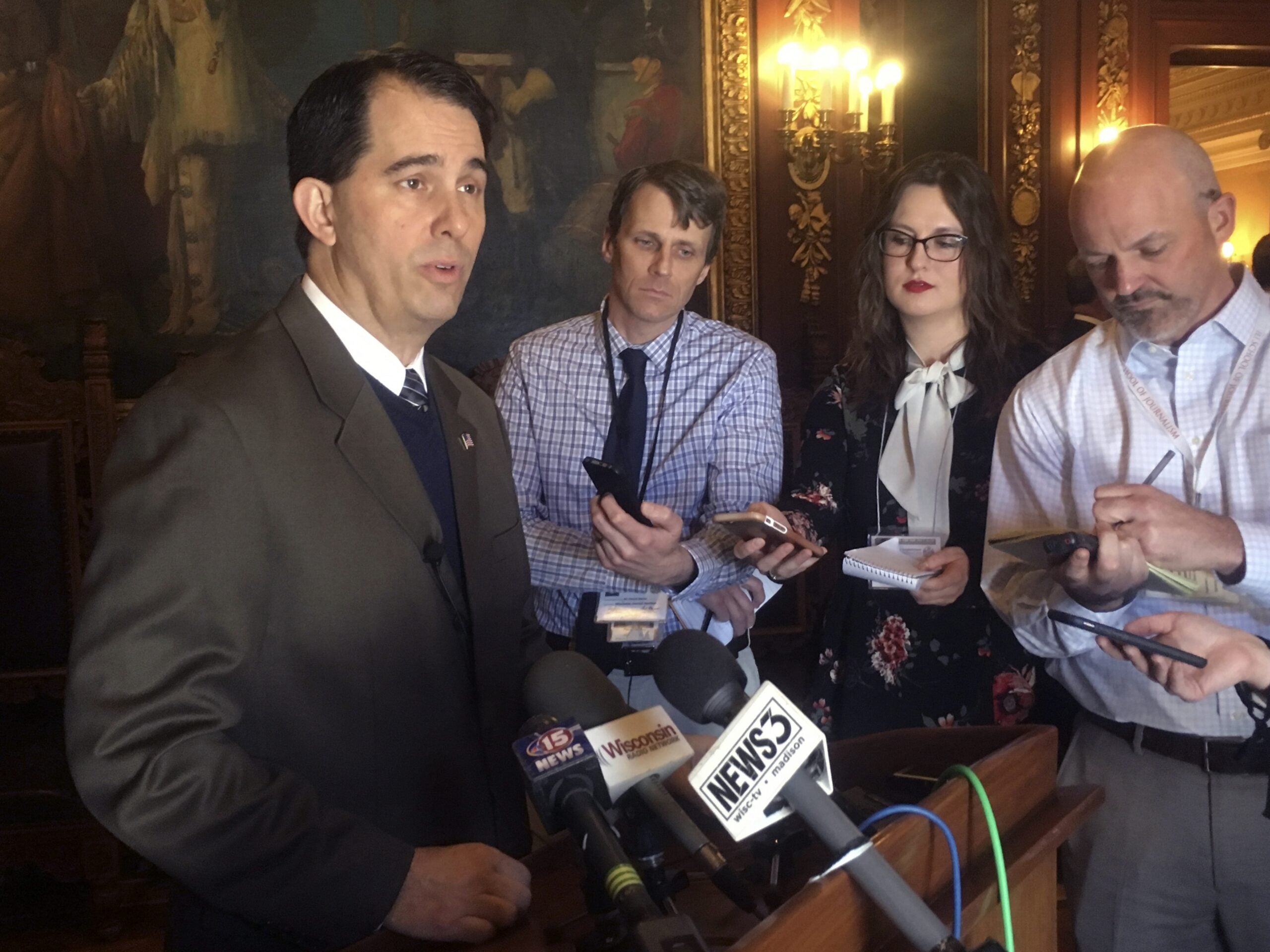 Wisconsin Gov. Scott Walker, speaks to reporters in Madison, Wisc.