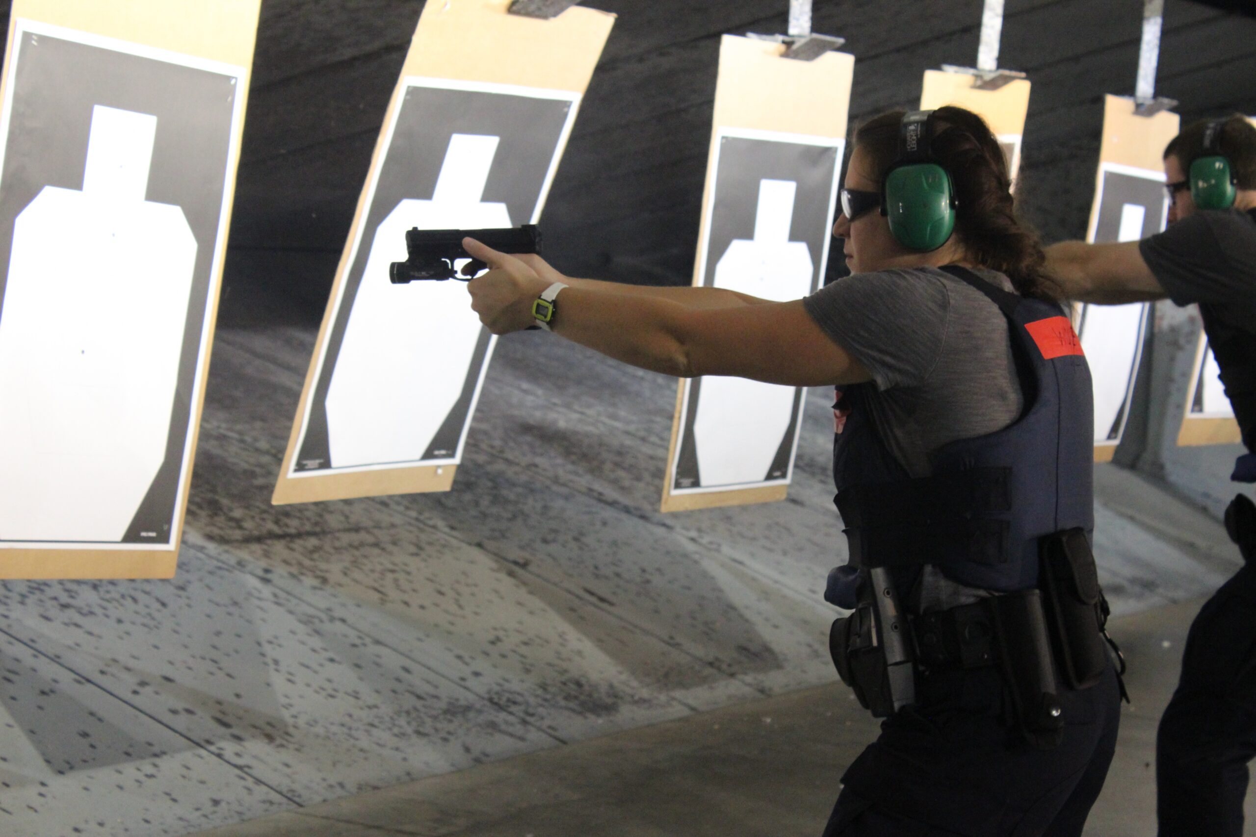 Recruit Jessica Wolf practices shooting at the Madison Police Training Center.