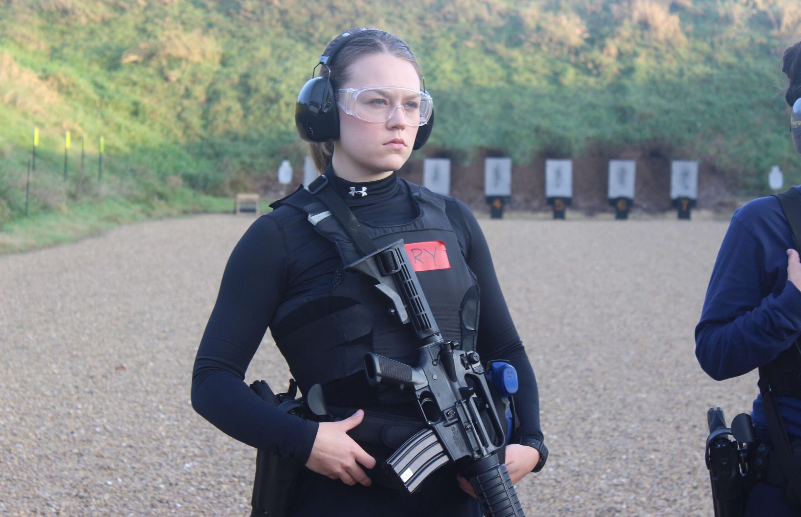 Recruit Samantha Tiry listens for instructions at the rifle shooting range at the Dane County Law Enforcement Training Center.