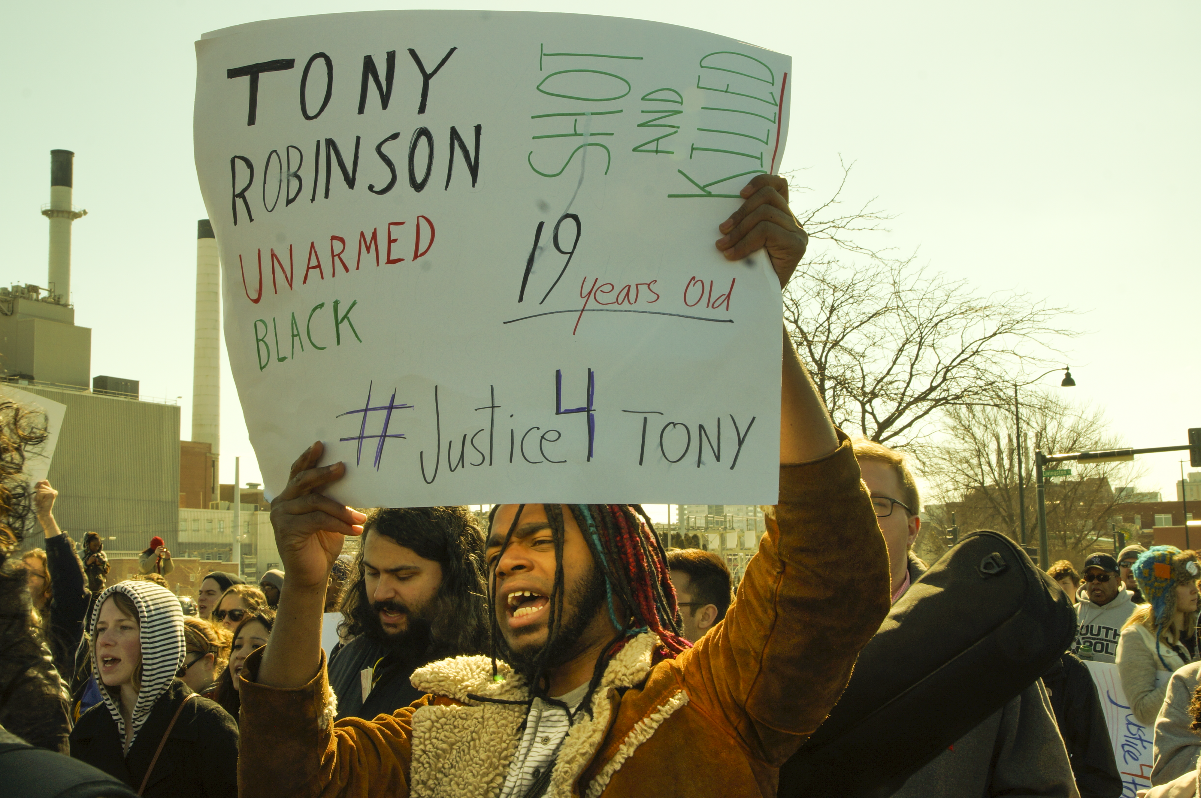 A man demonstrates on March 7, 2015 following the shooting death of Tony Robinson by Madison police.