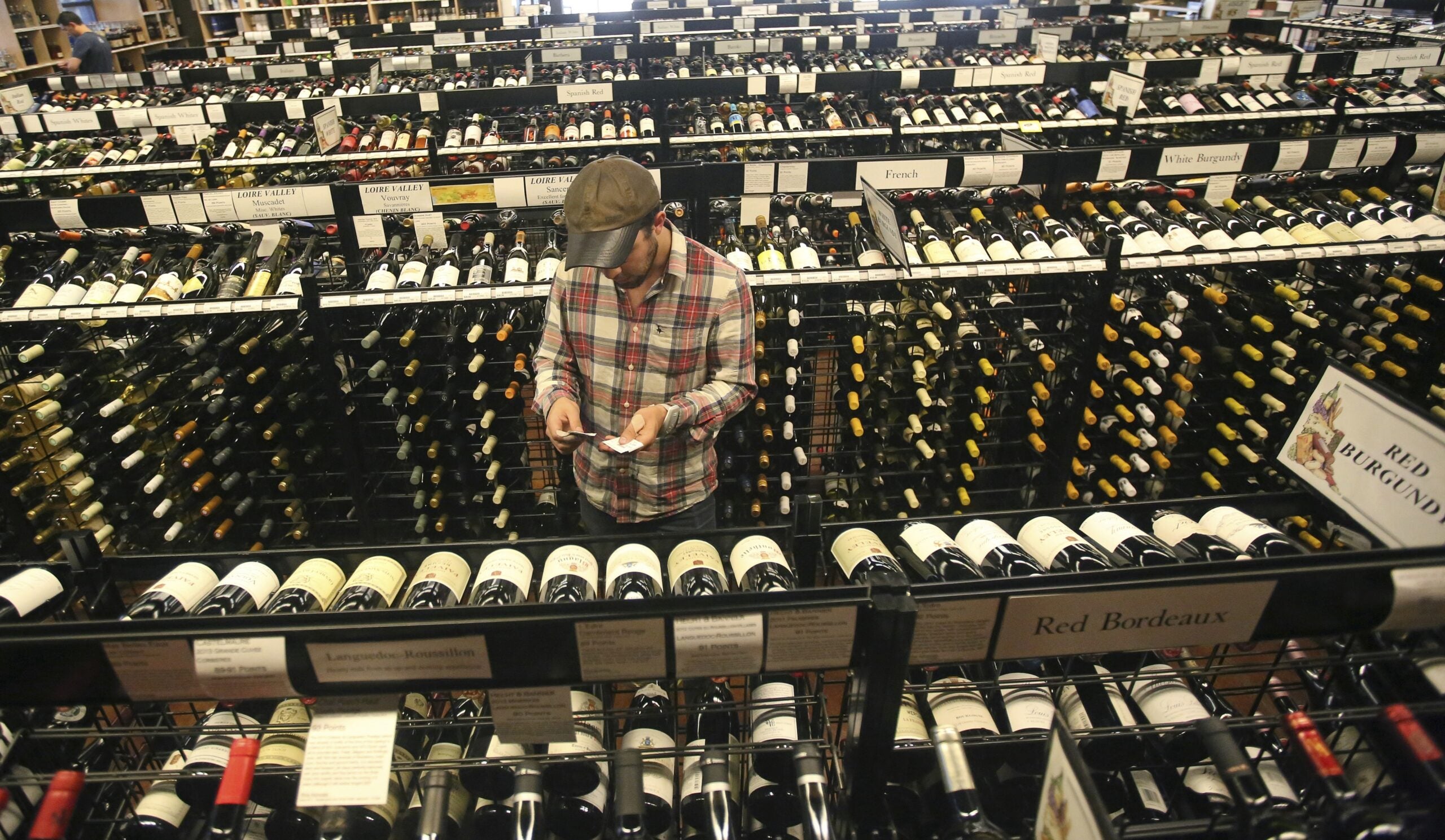 Man buying wine