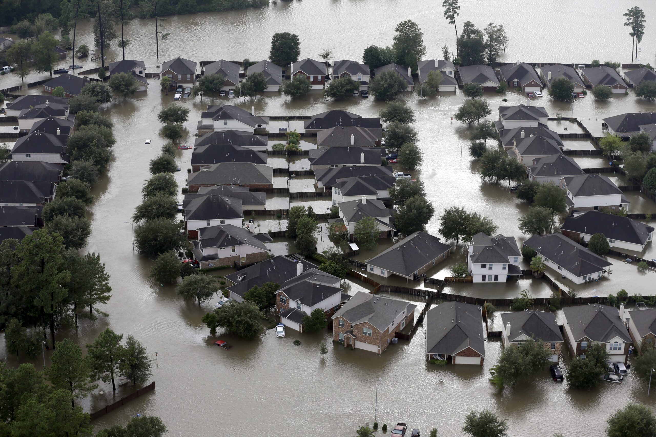 Homes are surrounded by floodwaters from Tropical Storm Harvey in Spring, Texas