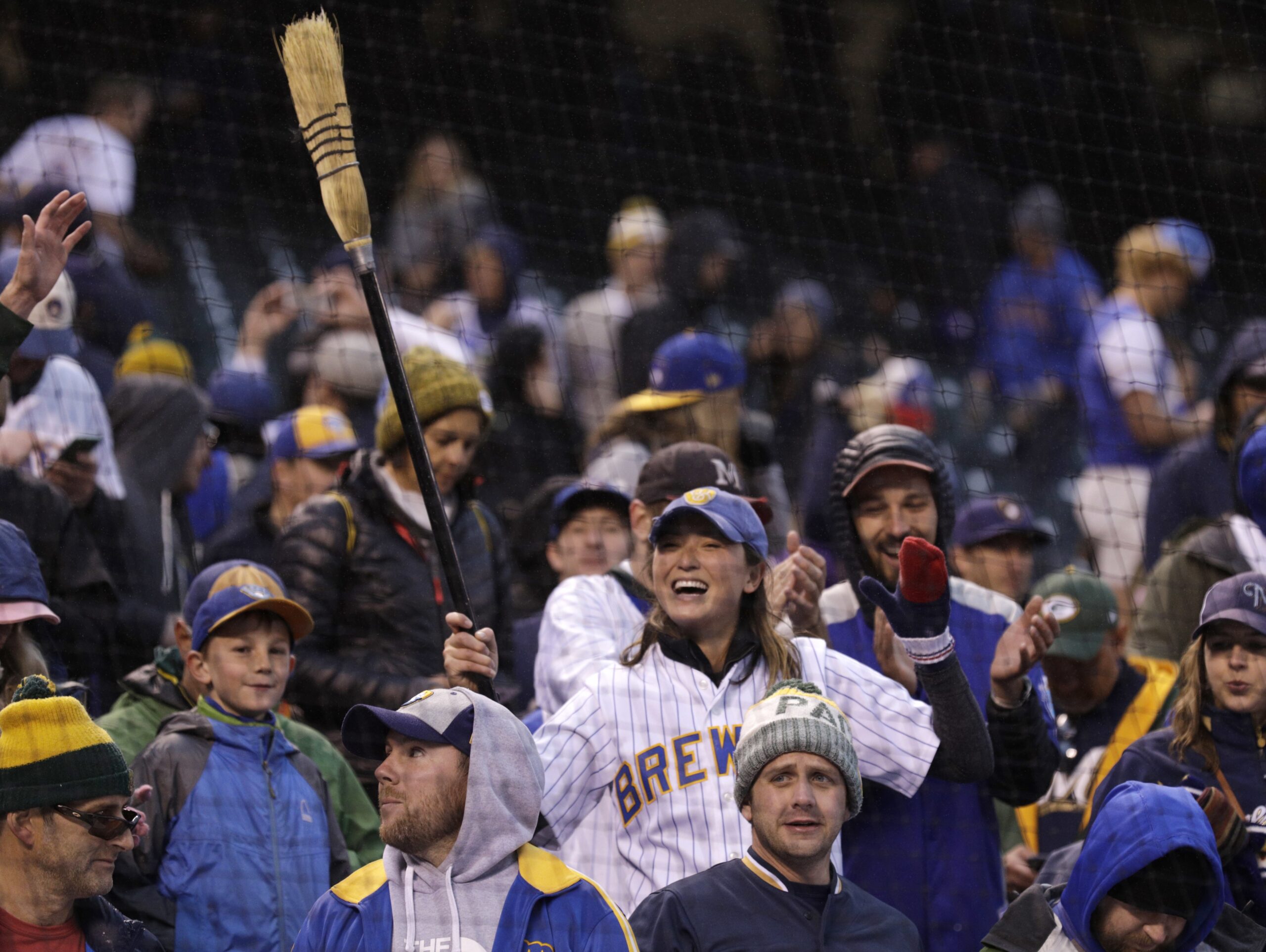 Brewers fan celebrates in the ninth inning of Game 3 of a baseball National League Division Series
