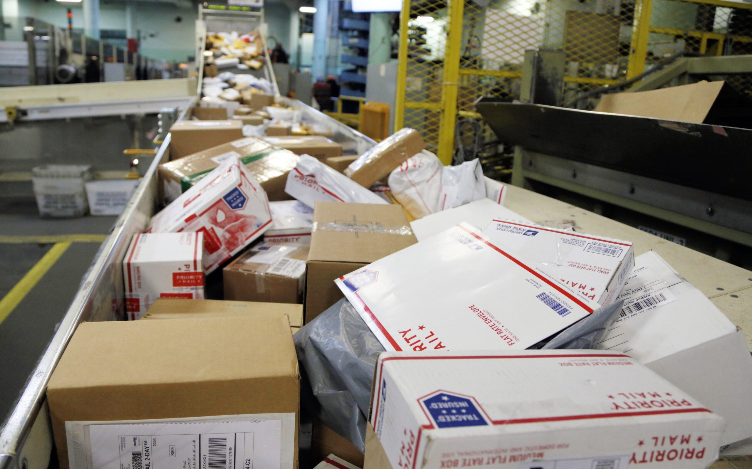 Packages being sorted at postal facility