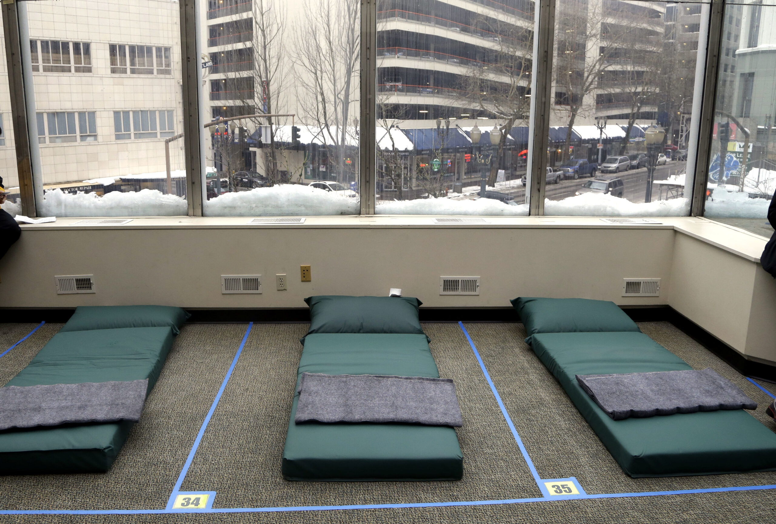 Beds in a homeless shelter are shown in Portland, Ore., Tuesday, Jan. 17, 2017