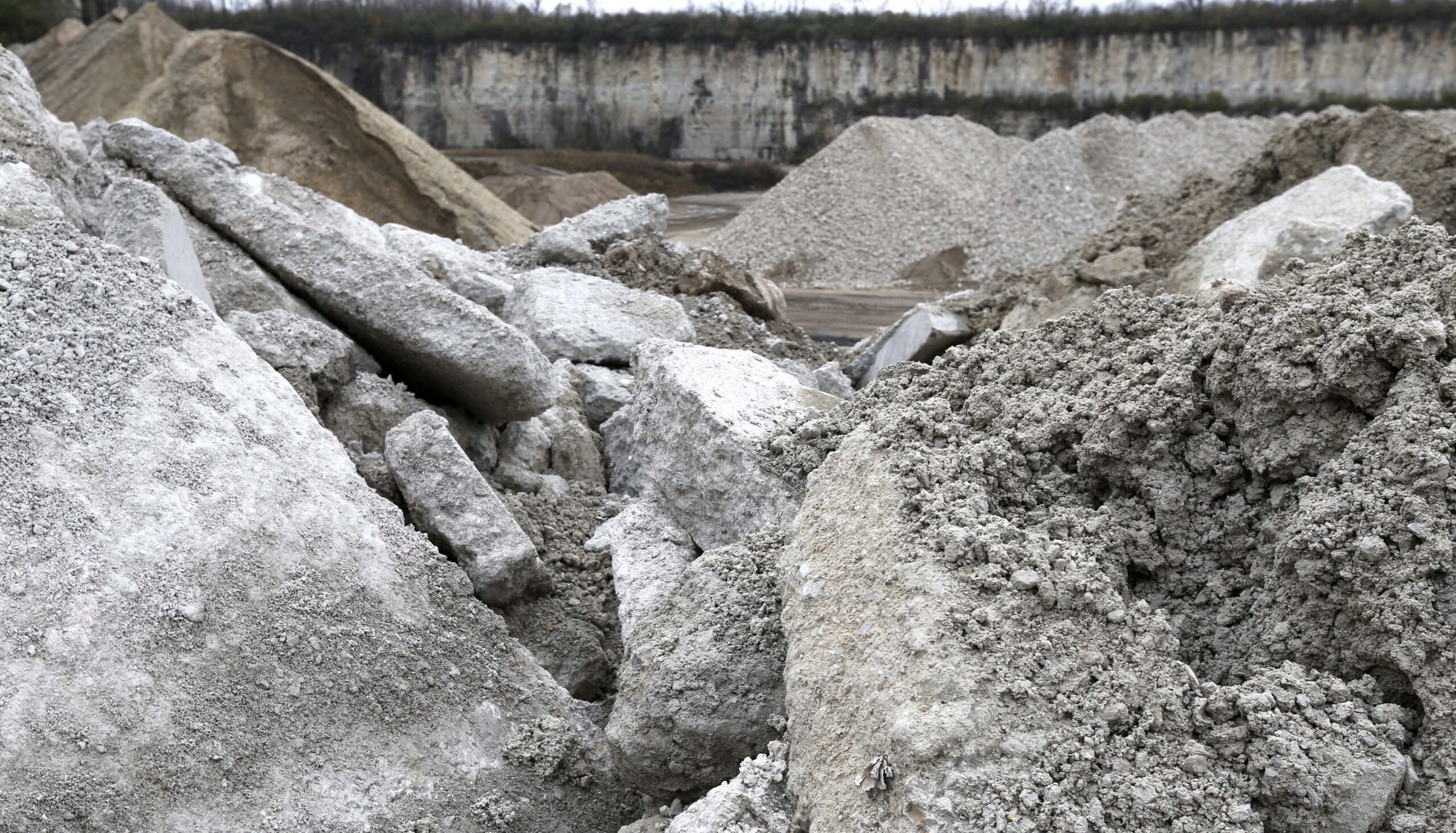 slabs of demolition concrete waste in a quarry