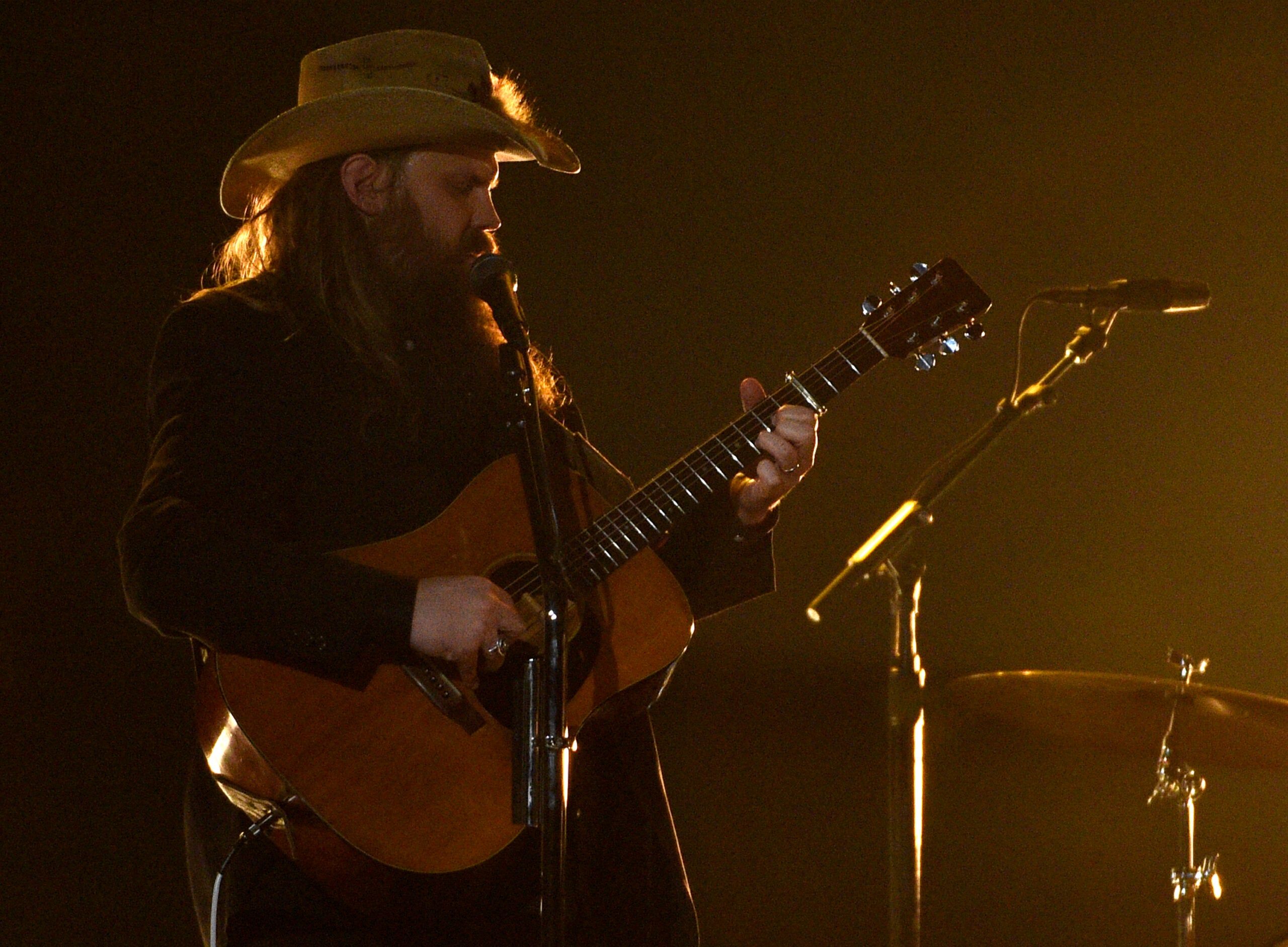 Chris Stapleton sings and plays guitar